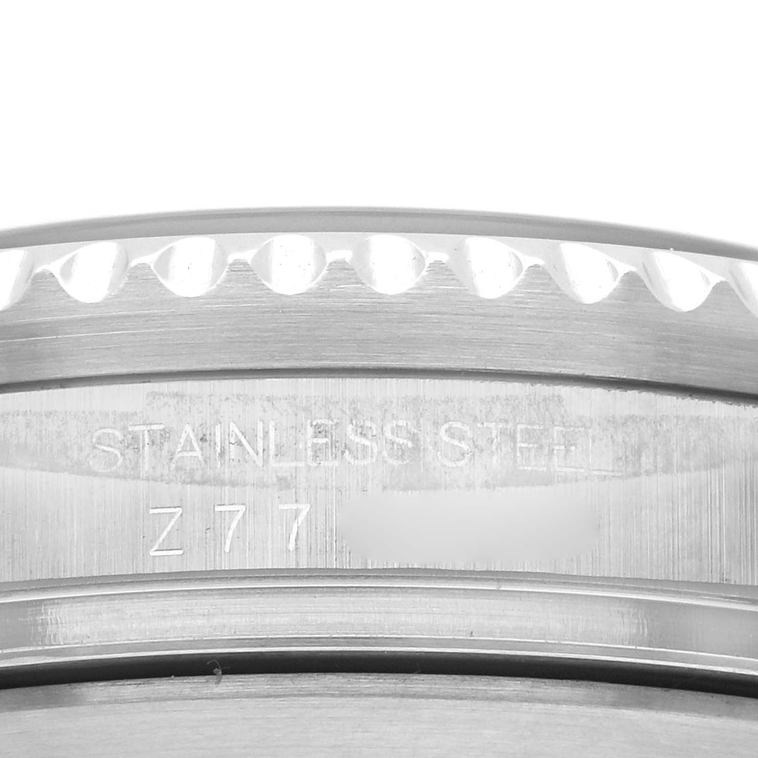 The image shows a close-up of the stainless steel bezel and part of the case of the Rolex Sea-Dweller 16600 Men's Stainless Steel Black Dial 16600 Men's Stainless Steel Black Dial watch, highlighting engravings.