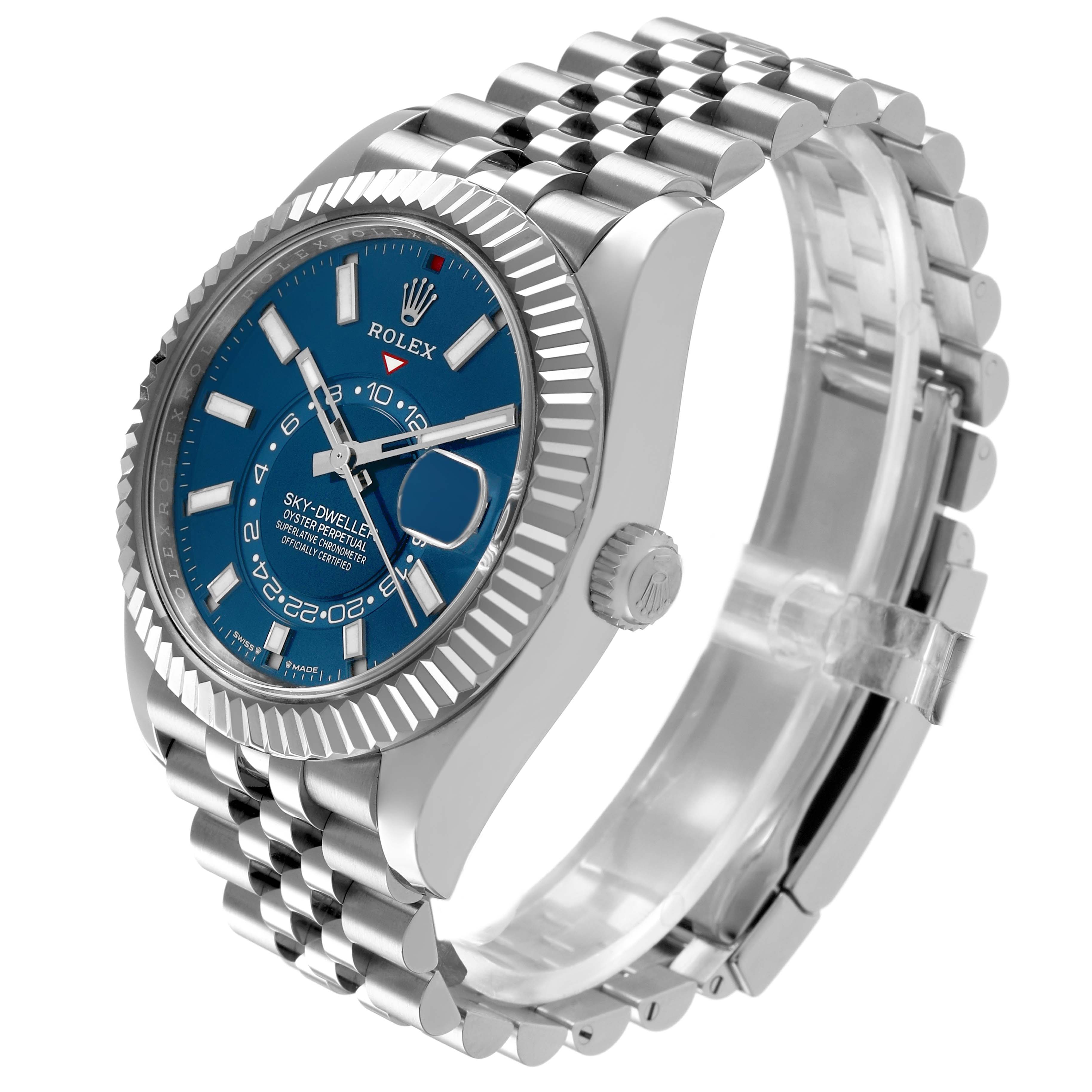 The Rolex Sky-Dweller 336934 Men's Stainless Steel Blue Dial watch is shown at a three-quarter angle, highlighting the blue dial, fluted bezel, and metal bracelet.