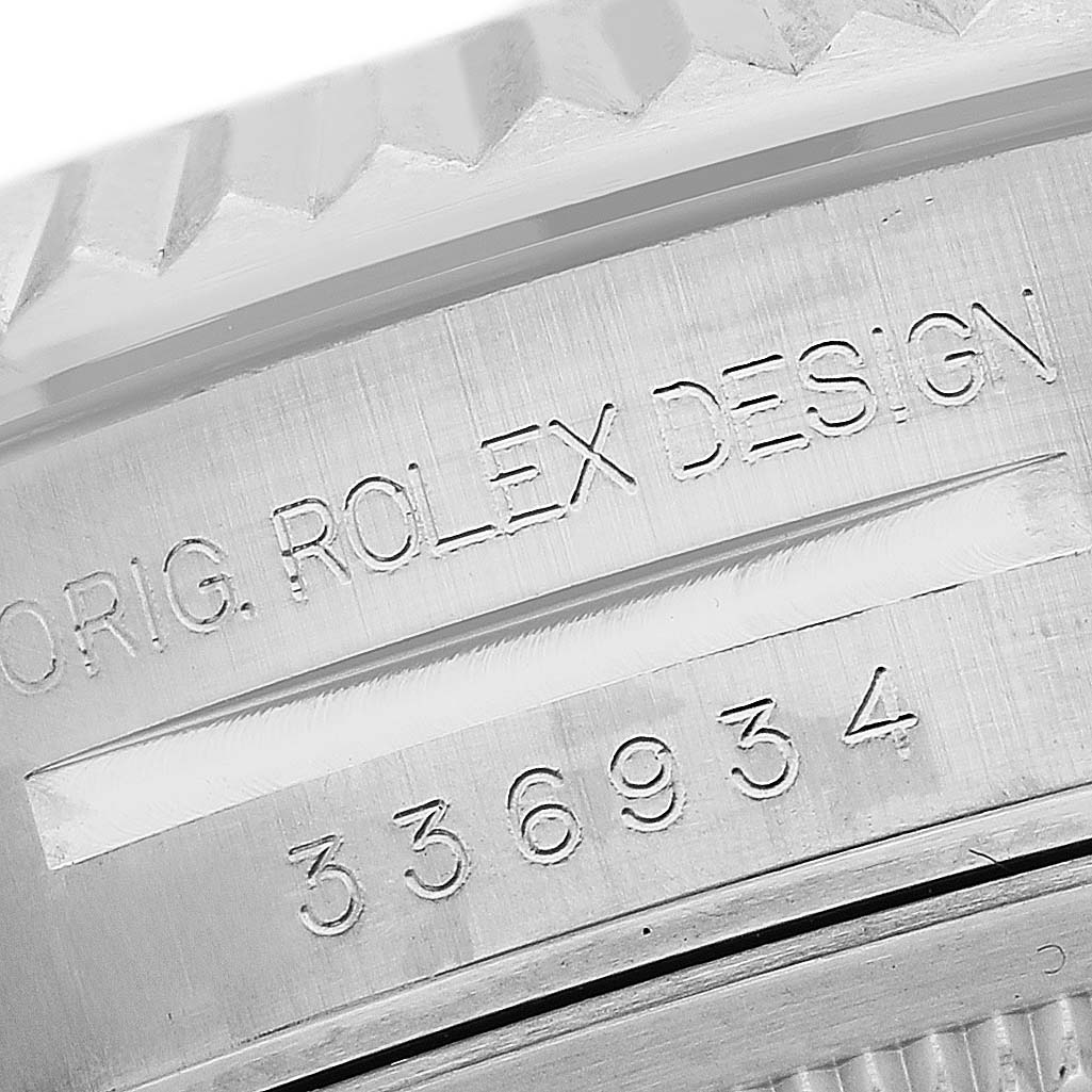 The image shows a close-up of the engraving on the side of the case of a Rolex Sky-Dweller 336934 Men's Stainless Steel Blue Dial, focusing on the model number and "ROLEXL DESIGN."