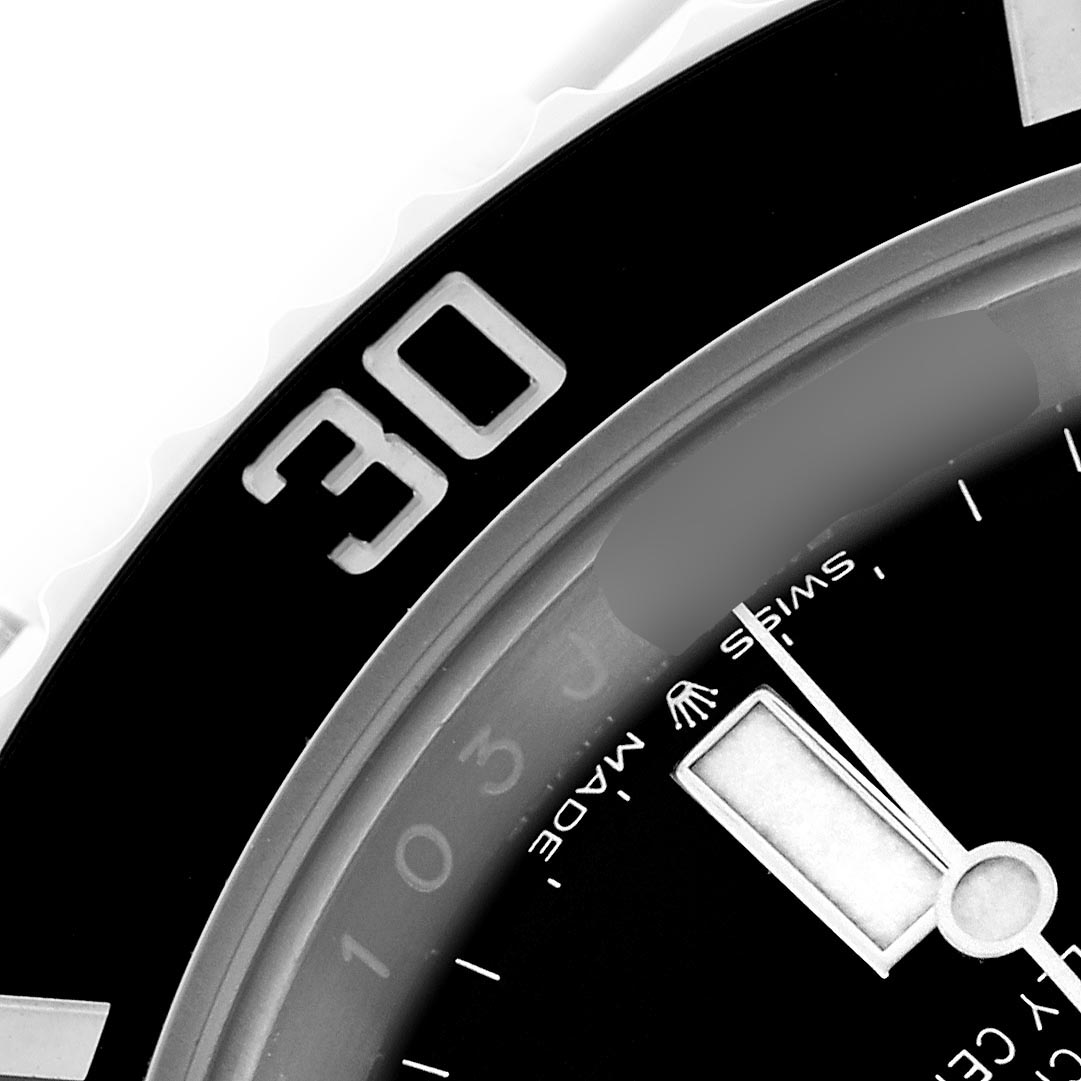 The image shows a close-up of the Rolex Submariner 126610LN Men's Stainless Steel Black Dial 126610LN Men's Stainless Steel Black Dial's dial and part of the rotating bezel at an angled view, highlighting the "30" marker.