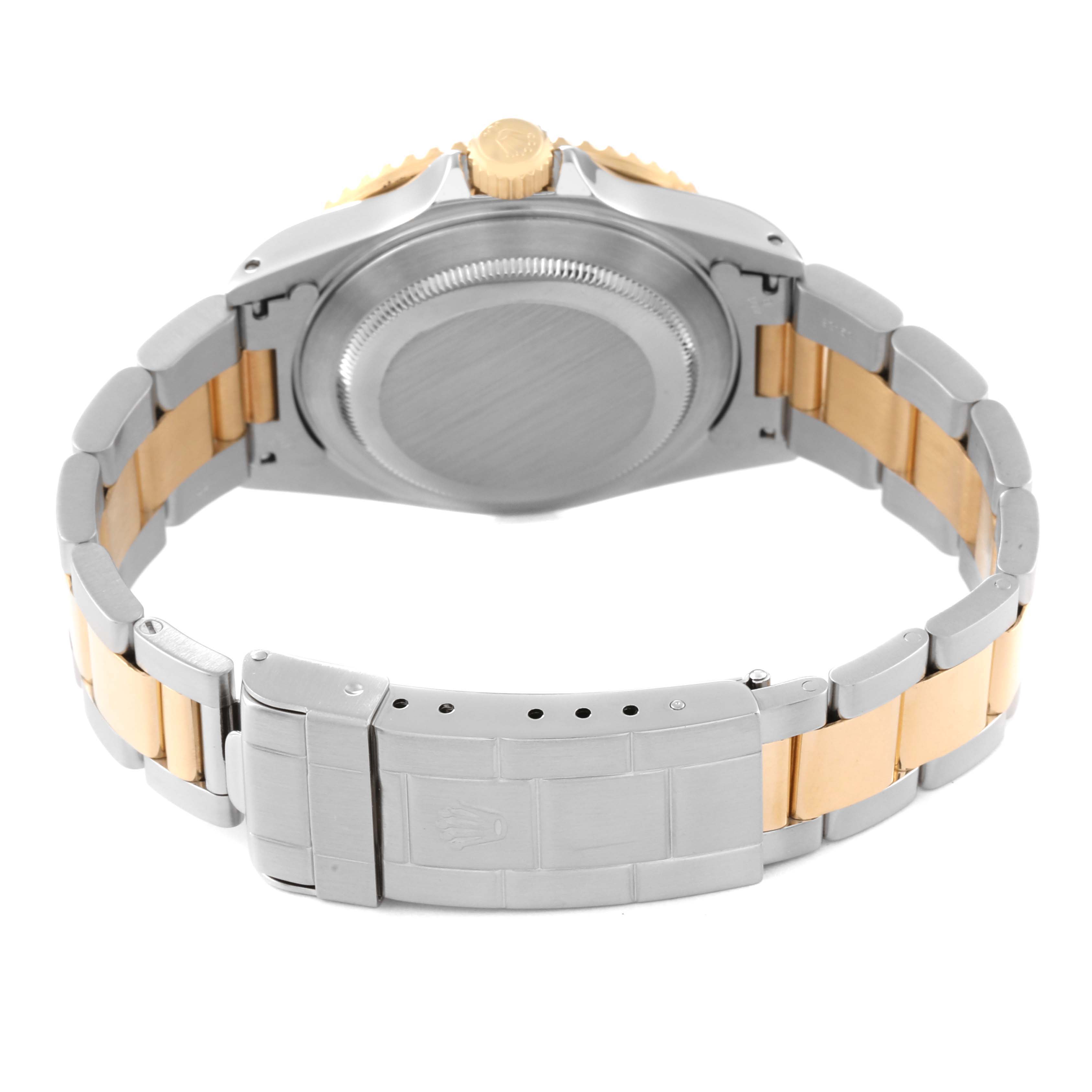 The image shows the back case, crown, and clasp of a Rolex Submariner 16613 Men's Steel and Gold (two tone) Blue Dial 16613 Men's Steel and Gold (two tone) Blue Dial watch from a rear angle.