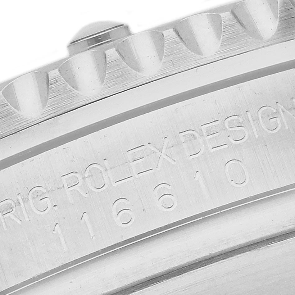 The image shows a close-up of the bezel and engraved edge of a Rolex Submariner 116610 Men's Stainless Steel Black Dial 116610 Men's Stainless Steel Black Dial model.