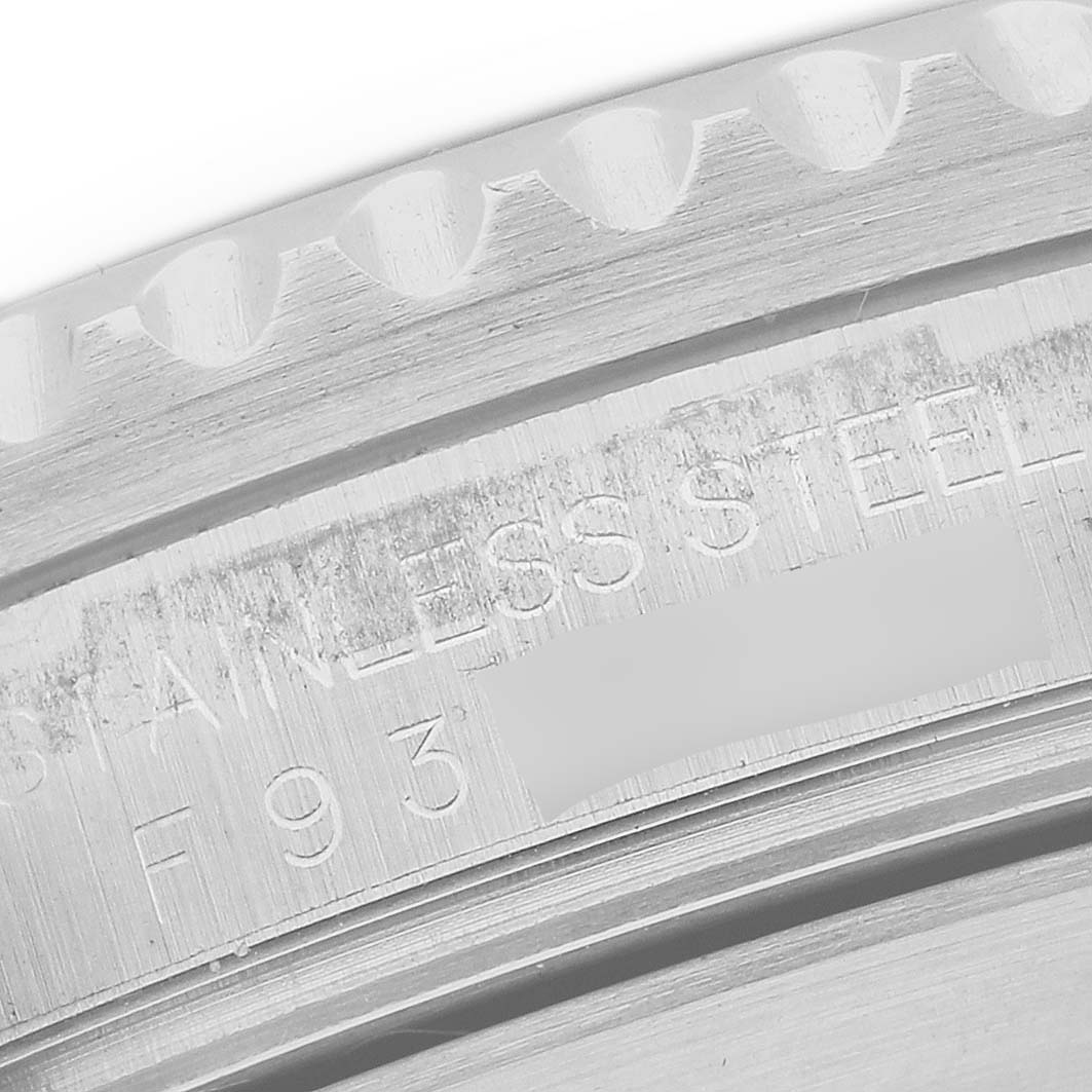 This image shows a close-up view of the bezel and case, highlighting the etched details of the Rolex Submariner 16610 Men
s Stainless Steel Black Dial 16610 Men
s Stainless Steel Black Dial model.