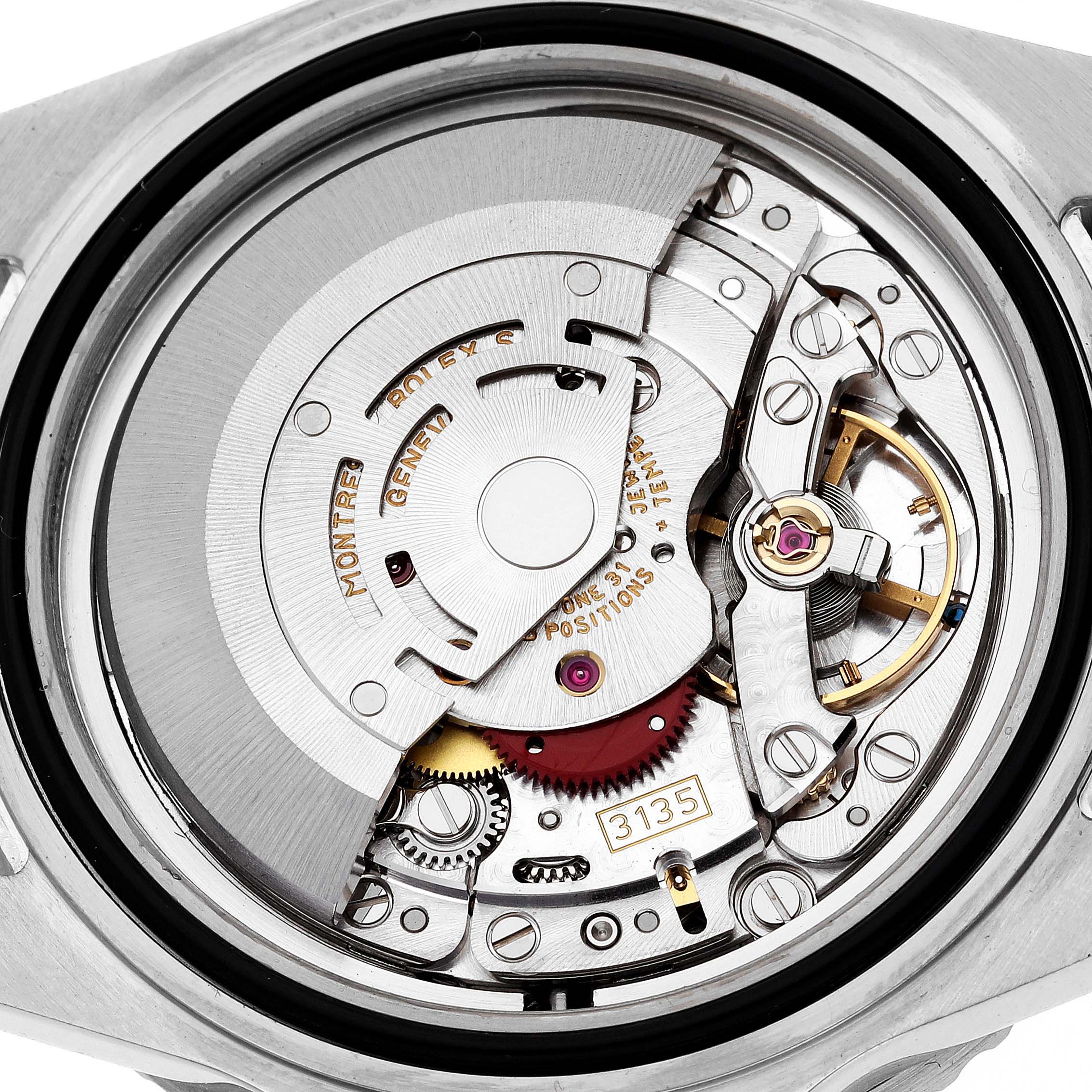 This image shows the detailed internal mechanism of a Rolex Submariner 16610 Men
s Stainless Steel Black Dial 16610 Men
s Stainless Steel Black Dial watch from a close-up angle.