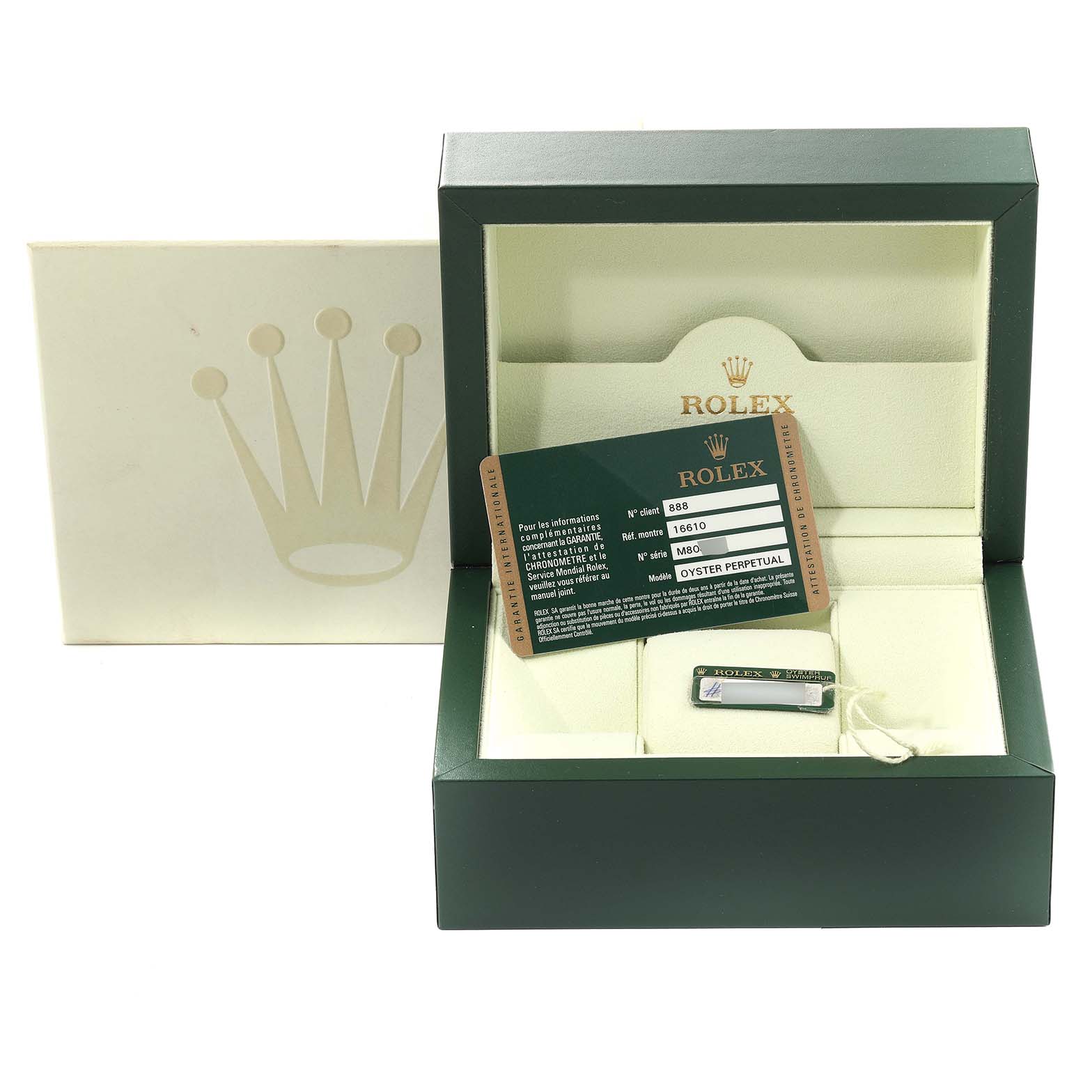 The image shows a Rolex Submariner 16610 Men
s Stainless Steel Black Dial 16610 Men
s Stainless Steel Black Dial watch box and its accessories, including a warranty card and a tag.