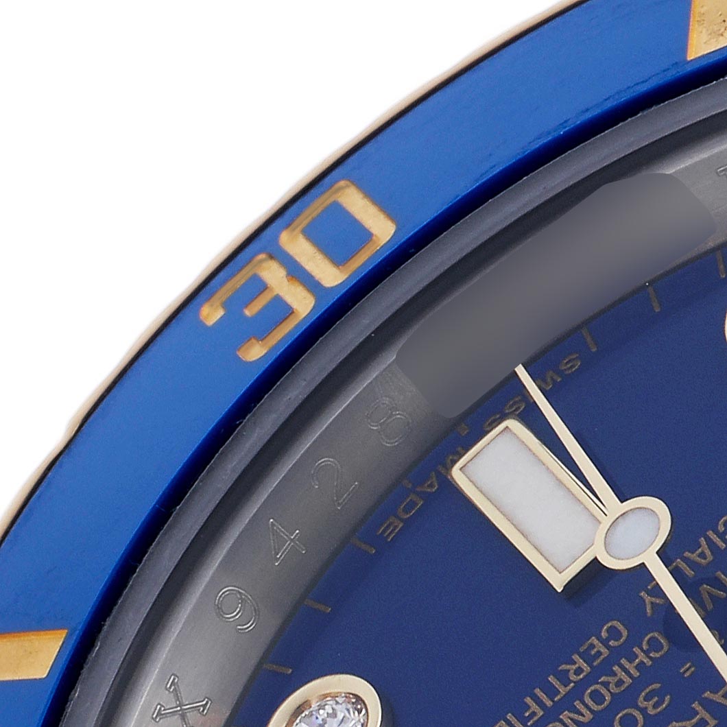 The image shows a close-up of the bezel and part of the dial of a Rolex Submariner 116613LB Men's Steel and Gold (two tone) Blue Dial 116613LB Men's Steel and Gold (two tone) Blue Dial, focusing on the "30" marker.