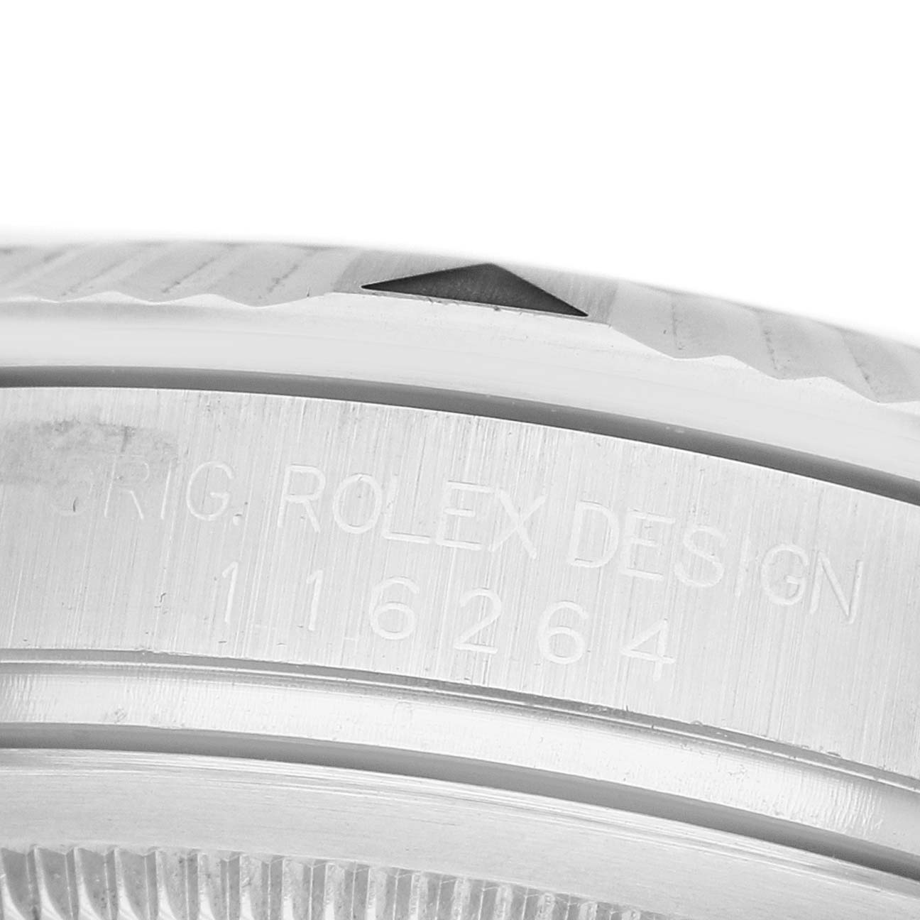 The image shows a close-up of the side of a Rolex Turn-o-Graph 116264 Men's Stainless Steel White Dial watch, featuring the bezel with engraved model details.