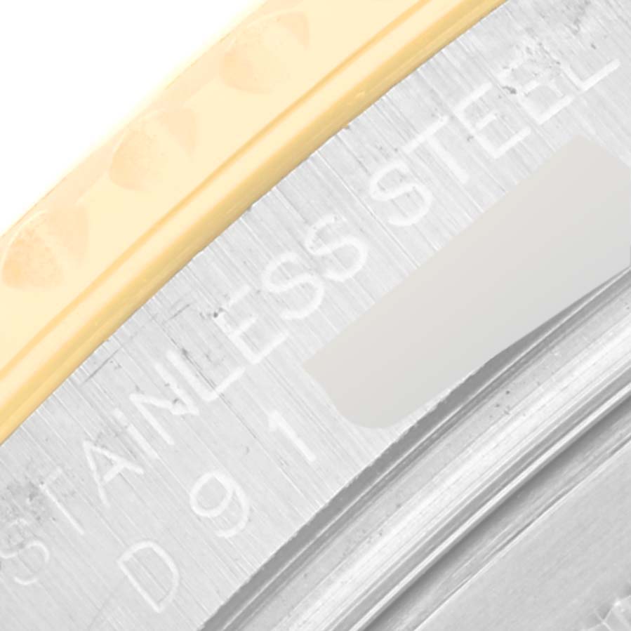 This image shows a close-up of the bezel and case of a Rolex Yacht-Master 16623 Men's Steel and Gold (two tone) Champagne Dial 16623 Men's Steel and Gold (two tone) Champagne Dial, highlighting its stainless steel and gold elements.