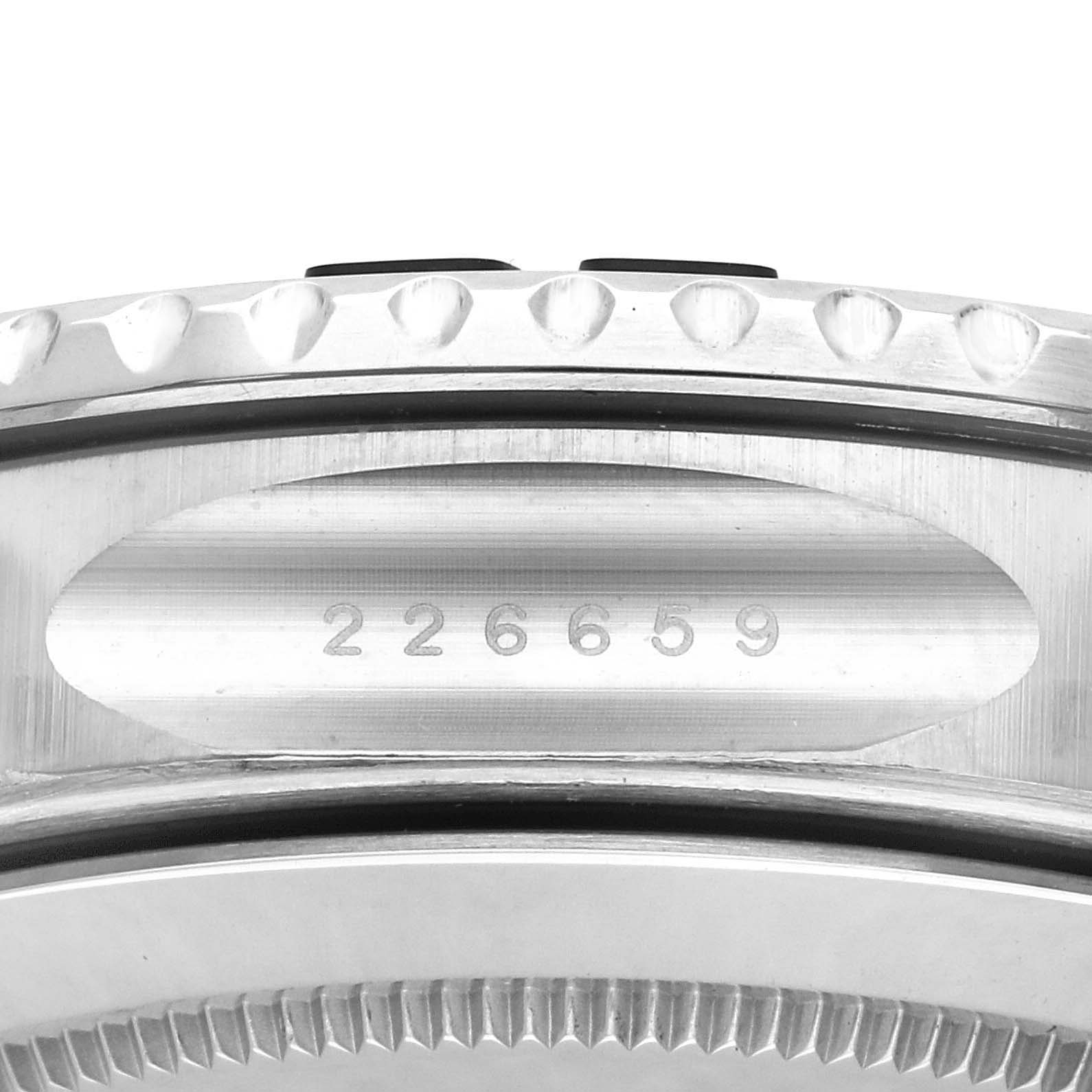 The image shows a close-up side view of the Rolex Yacht-Master 226659 Men's White Gold Black Dial 226659 Men's White Gold Black Dial watch, highlighting the bezel and engraved serial number.
