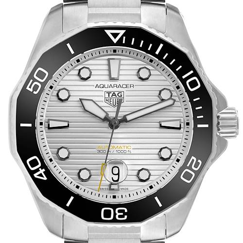 The Tag Heuer Aquaracer is shown from the front, highlighting the dial, bezel, and date window.