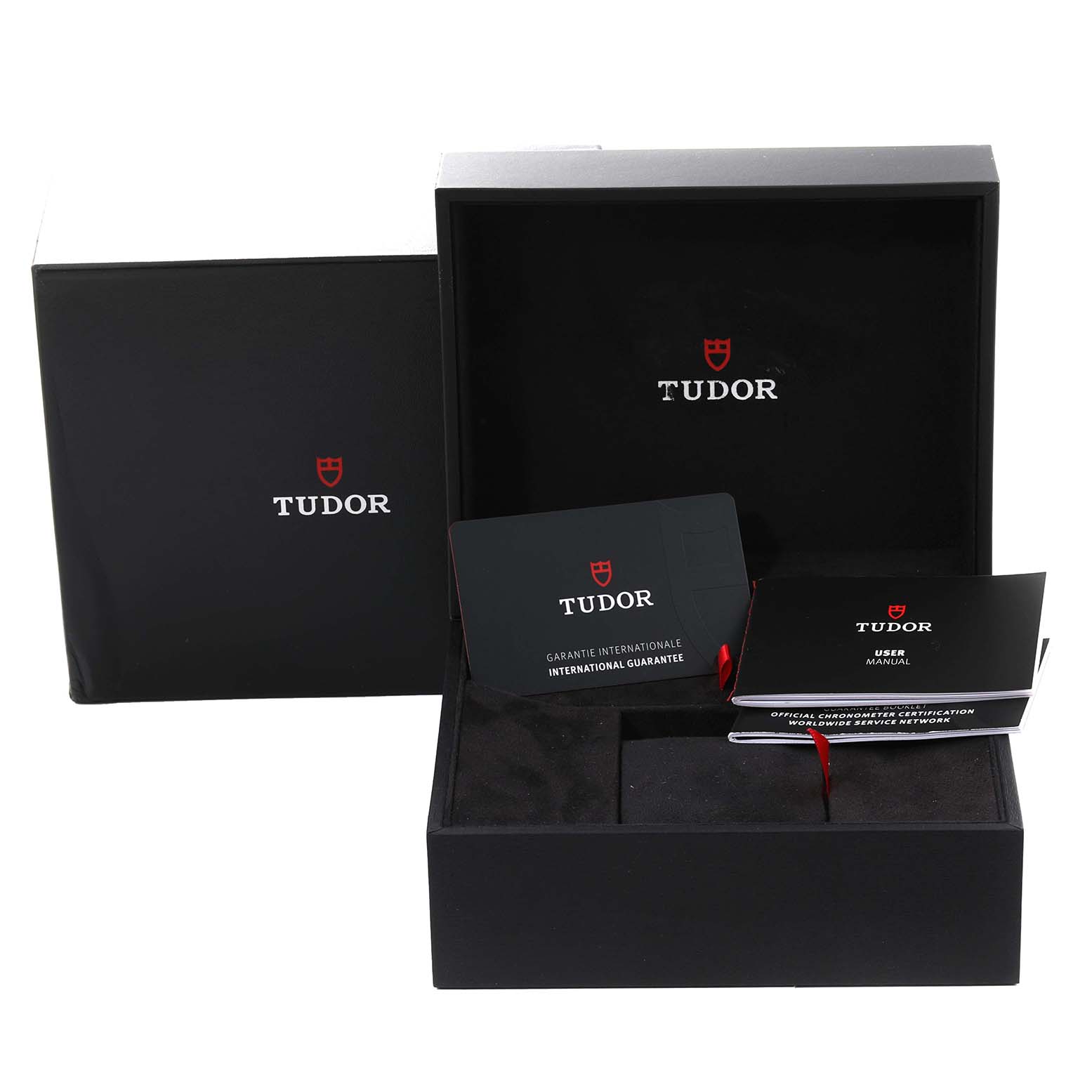 The image shows the Tudor Heritage Black Bay M79470-0001 Men
s Stainless Steel Black Dial M79470-0001 Men
s Stainless Steel Black Dial
s box, international guarantee card, and user manual at an angled view.