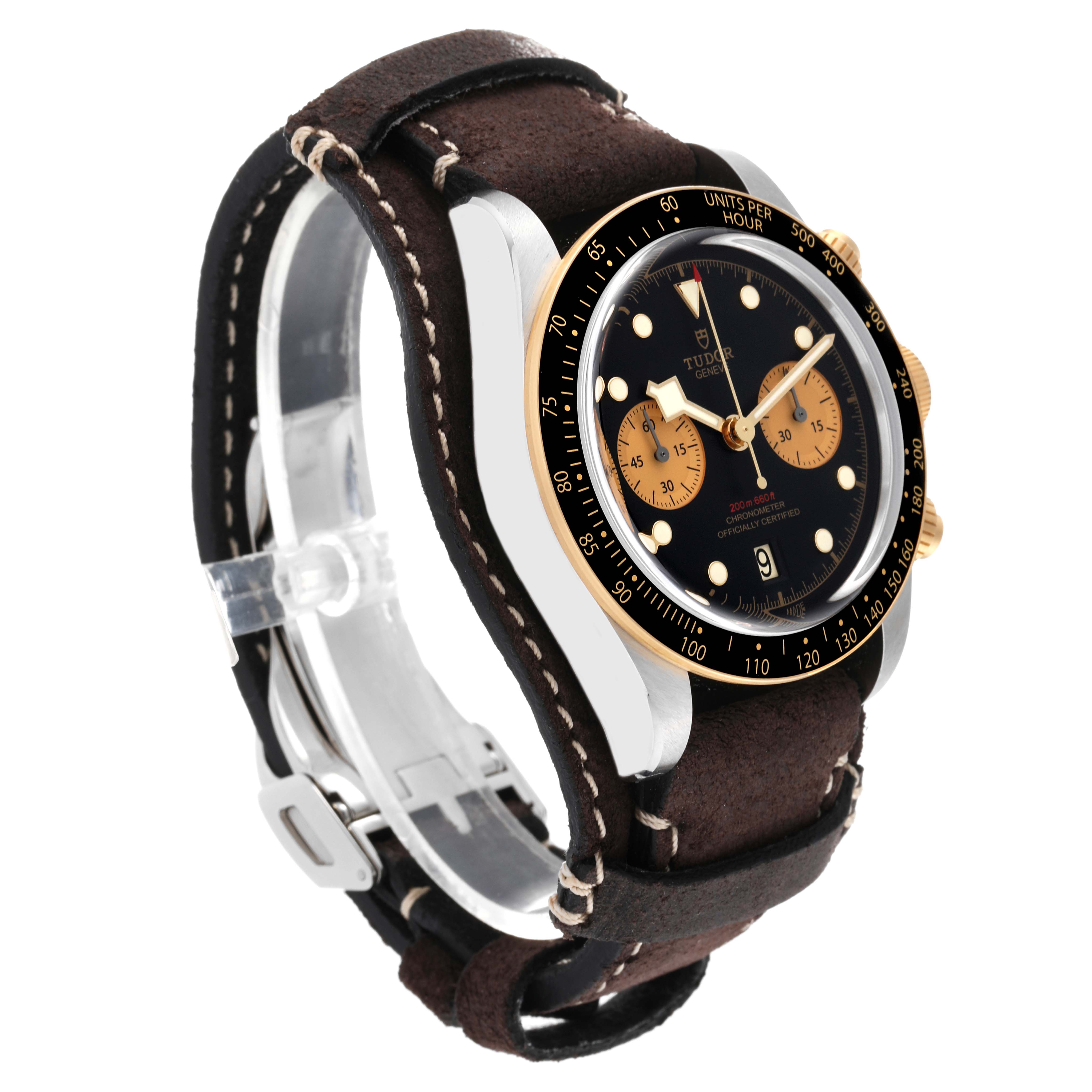 The Tudor Heritage Black Bay 79363N Men
s Steel and Gold (two tone) Black Dial 79363N Men
s Steel and Gold (two tone) Black Dial watch is shown at a three-quarter angle, displaying the face, case, crown, and leather strap.