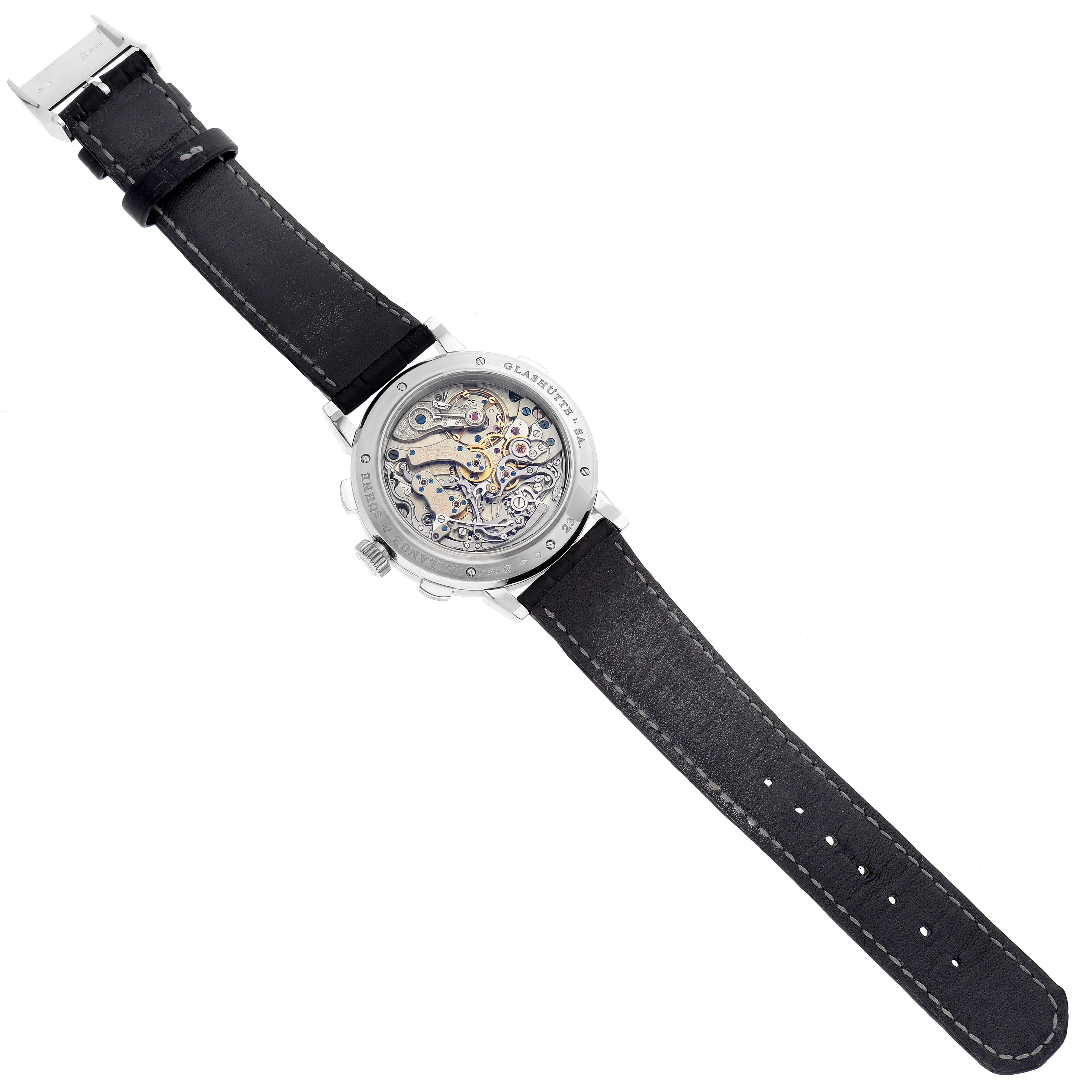 The image displays the A. Lange 
Sohne Datograph watch from the rear, showcasing its intricate mechanical movement and black leather strap.