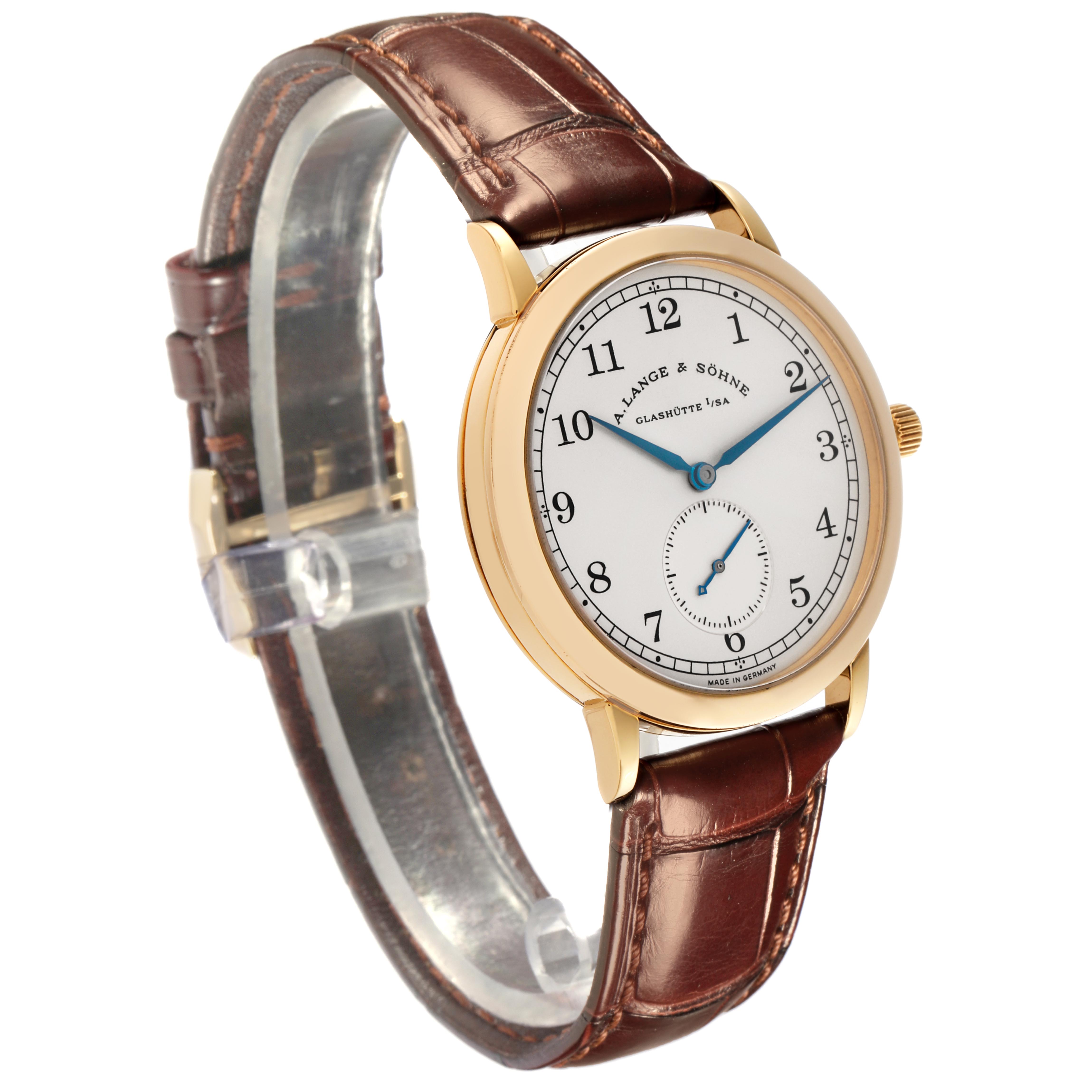 The A. Lange & Sohne 1815 206.021 Men's Yellow Gold Silver Dial watch is shown at an oblique angle, highlighting the gold case, dial, crown, and brown leather strap.