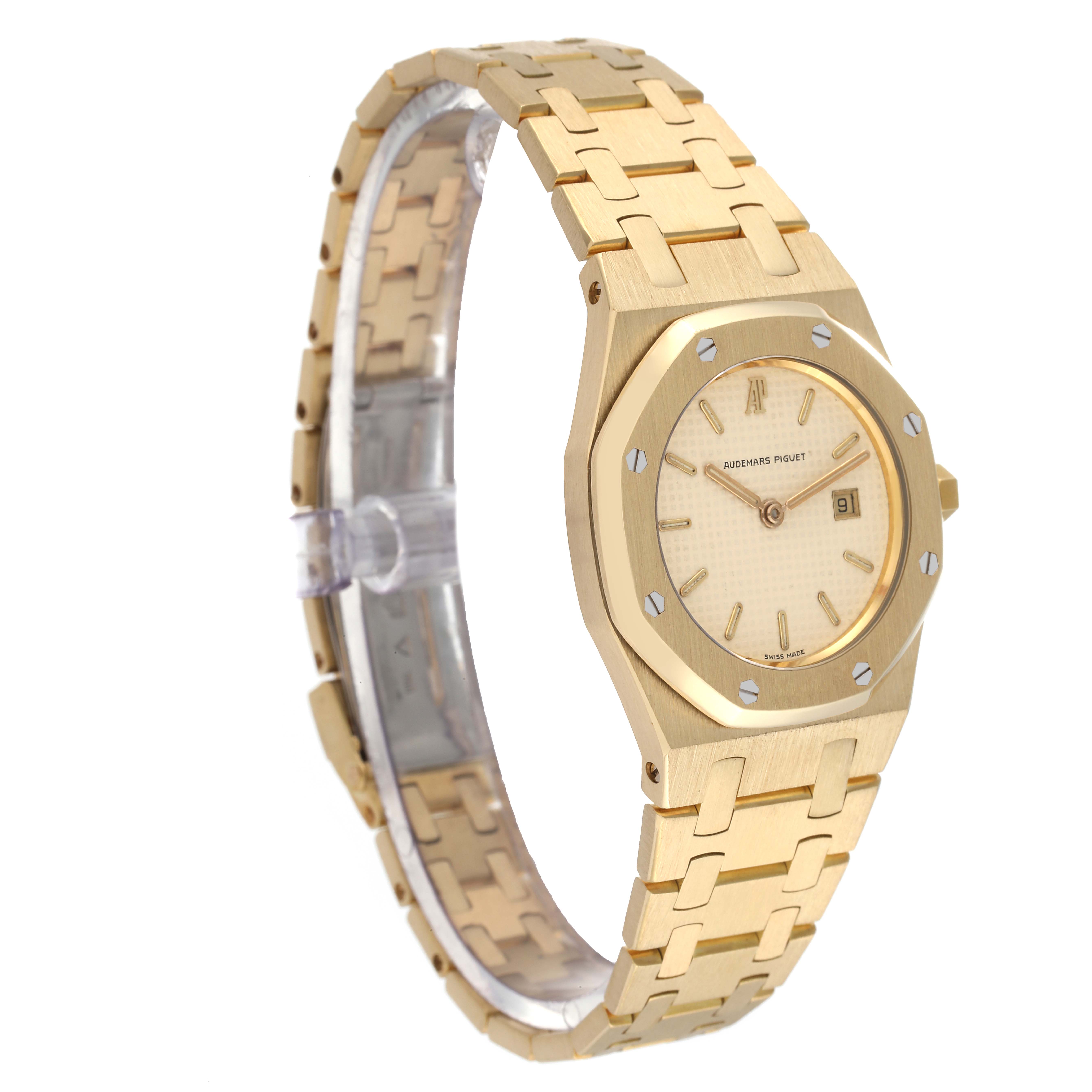 This image shows a side angle of the Audemars Piguet Royal Oak Women's Yellow Gold Beige Dial Women's Yellow Gold Beige Dial watch, displaying the dial and bracelet.