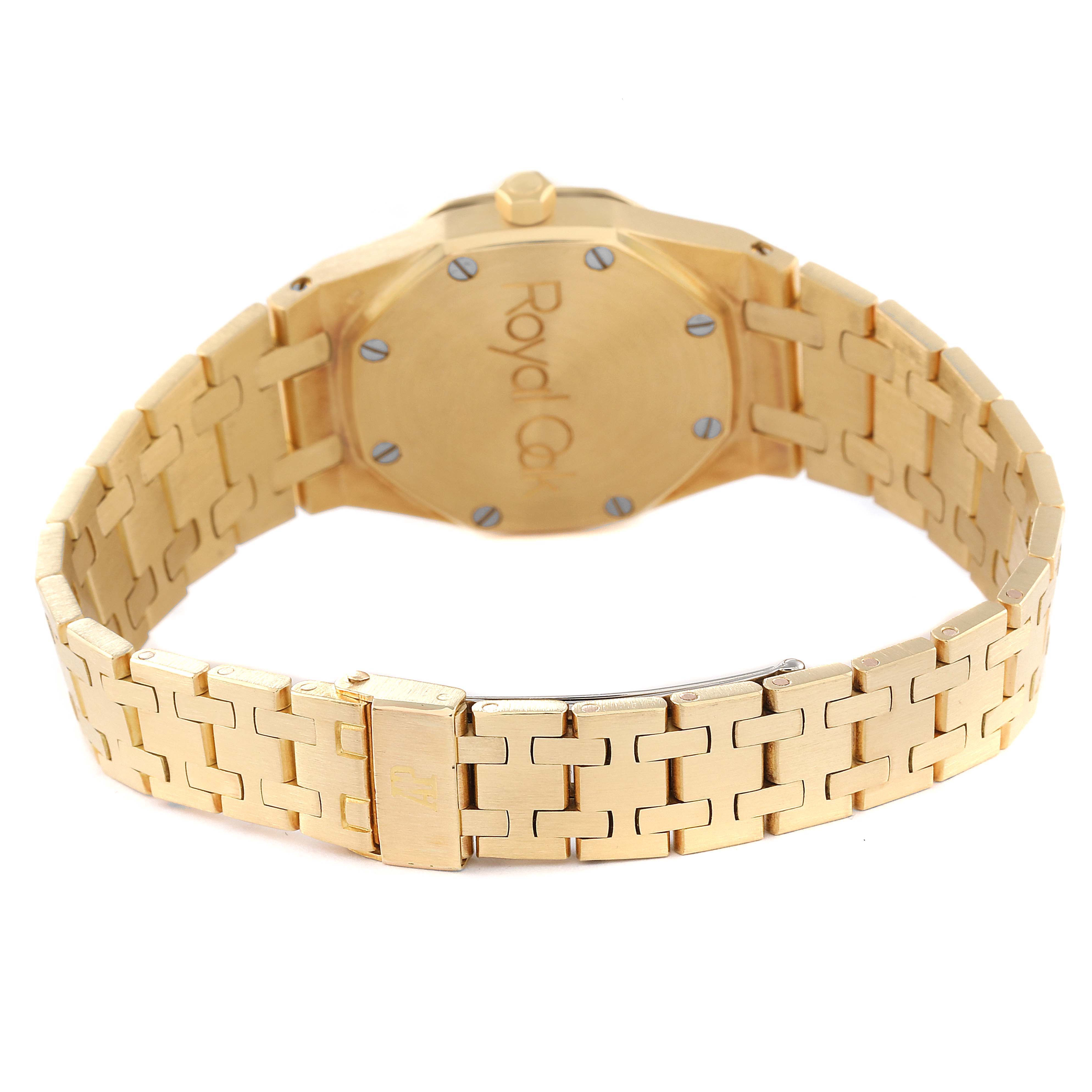 This image shows the back of an Audemars Piguet Royal Oak Women's Yellow Gold Beige Dial Women's Yellow Gold Beige Dial watch, highlighting its bracelet and clasp.