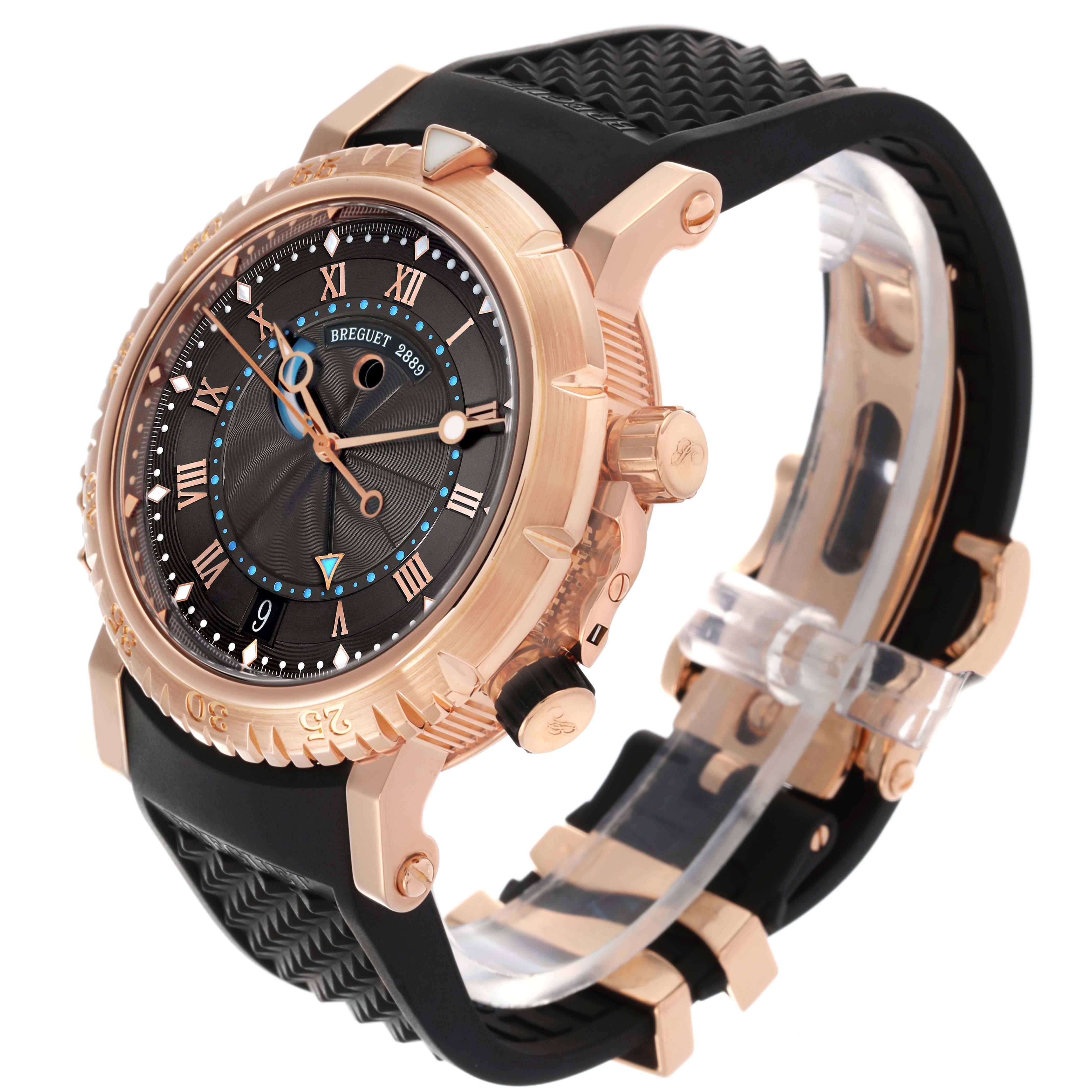 The Breguet Marine 5847BR/Z2/5ZV Men's Rose Gold Black Dial 5847BR/Z2/5ZV Men's Rose Gold Black Dial watch is shown from a three-quarter angle, highlighting the rose gold case, black dial, and rubber strap.