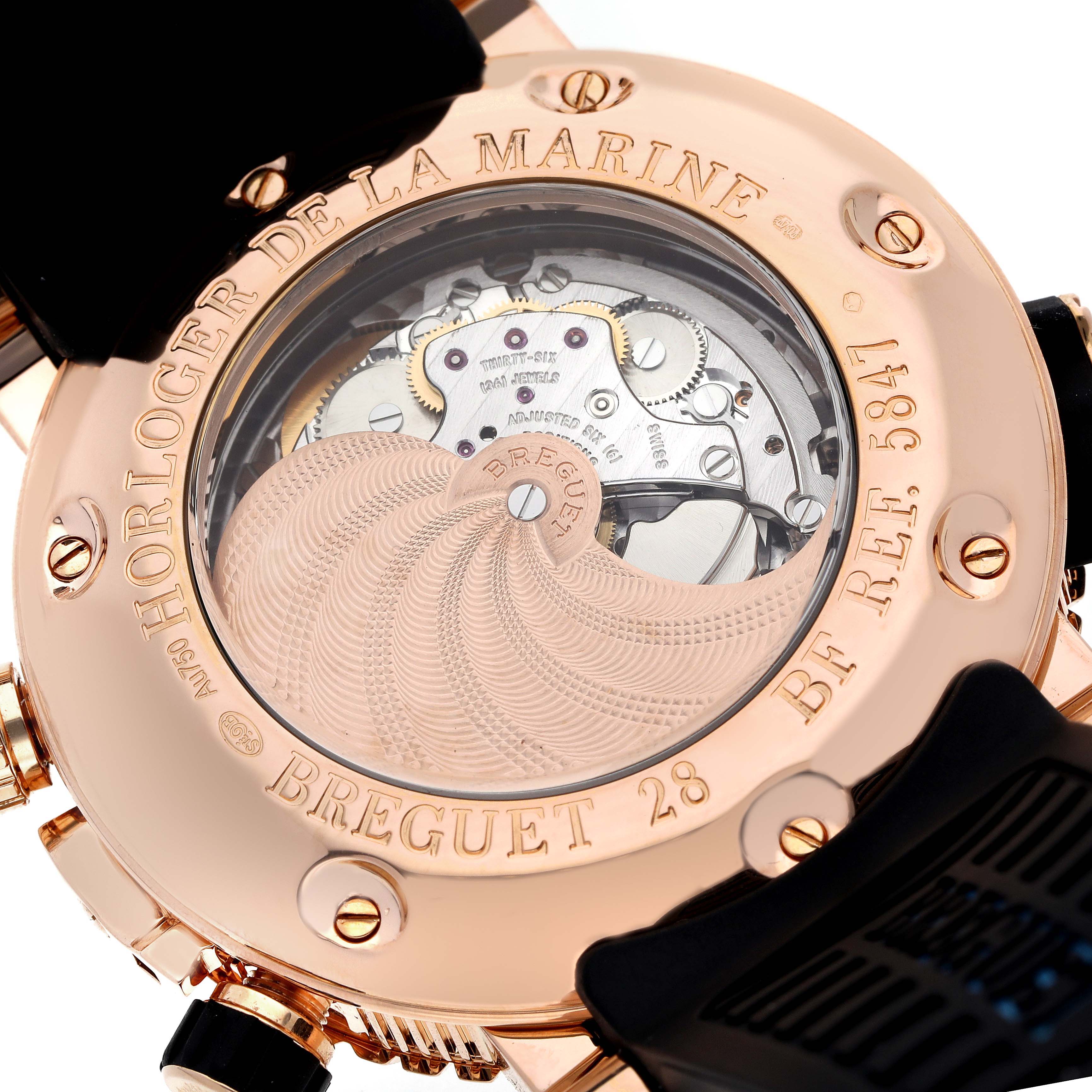 The image shows the back view of a Breguet Marine 5847BR/Z2/5ZV Men's Rose Gold Black Dial 5847BR/Z2/5ZV Men's Rose Gold Black Dial watch, highlighting the movement and engravings.
