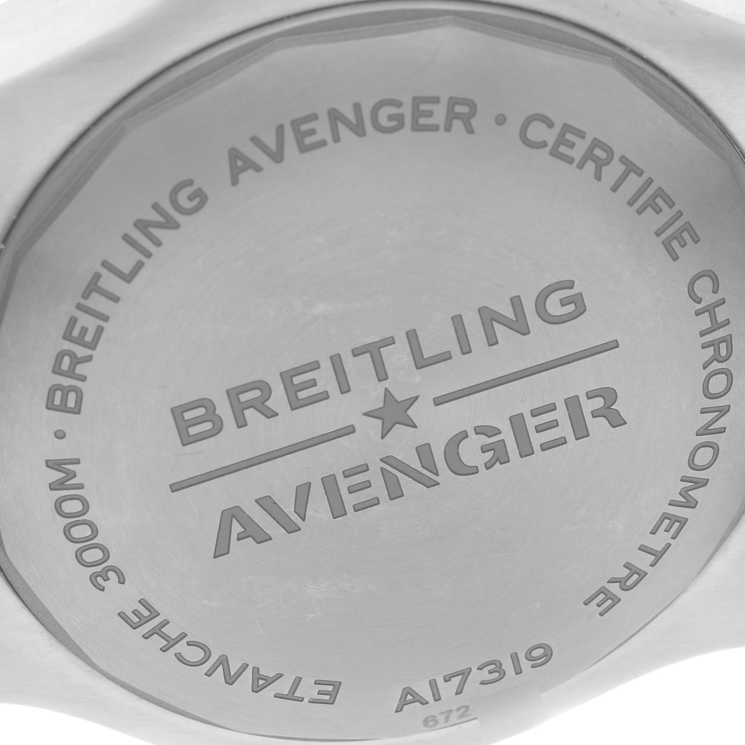 The image shows the case back of a Breitling Avenger A17319 Men's Stainless Steel Yellow Dial A17319 Men's Stainless Steel Yellow Dial watch, highlighting engravings and model details.