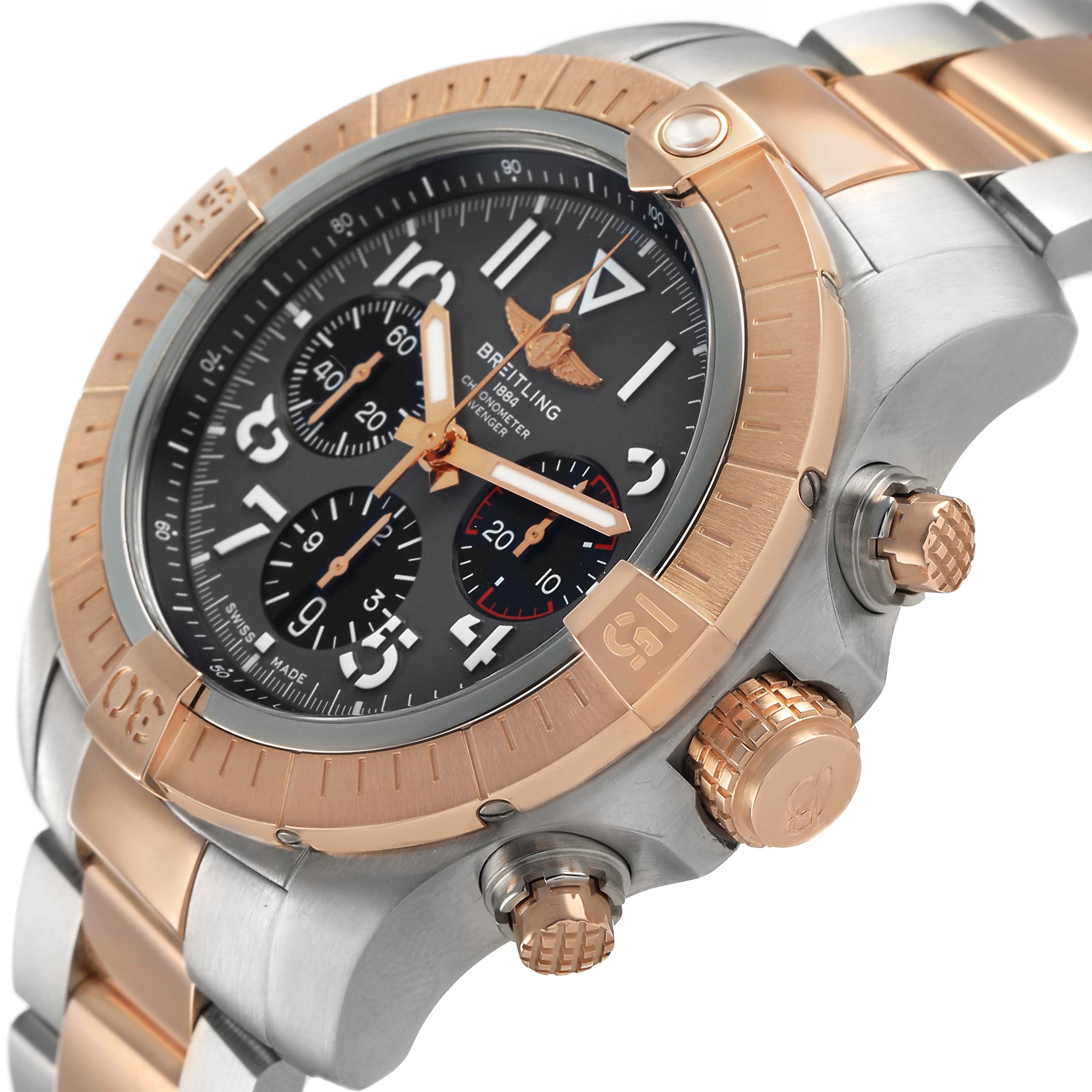 The Breitling Avenger UB01821A1B1U1 Men's Steel and Gold (two tone) Grey Dial watch is shown at a slight angle, highlighting the bezel, crown, pushers, and part of the bracelet.