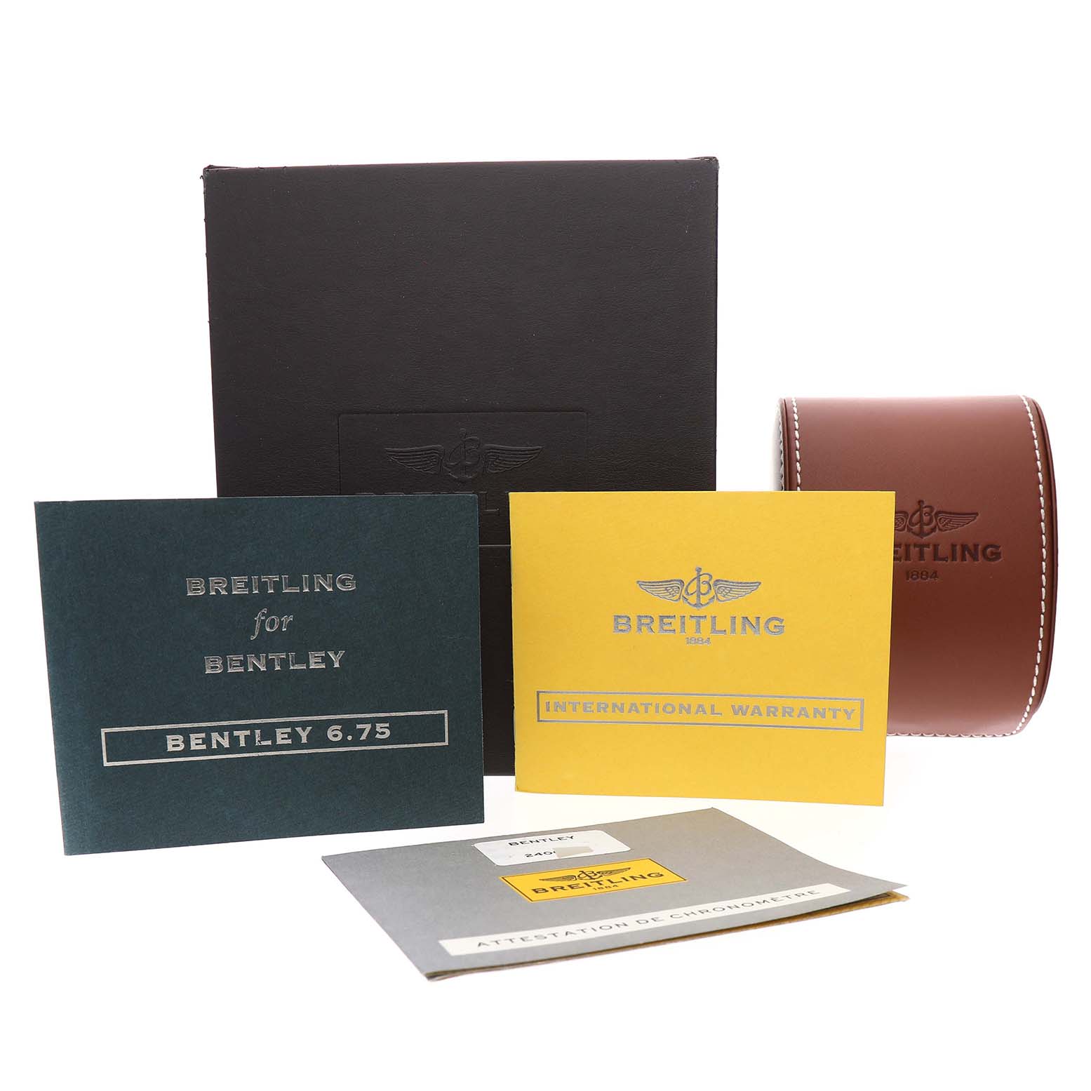 The image shows accessories for the Breitling Bentley A44364 Men's Stainless Steel Silver Dial model, including booklets, a warranty card, a case, and boxes.