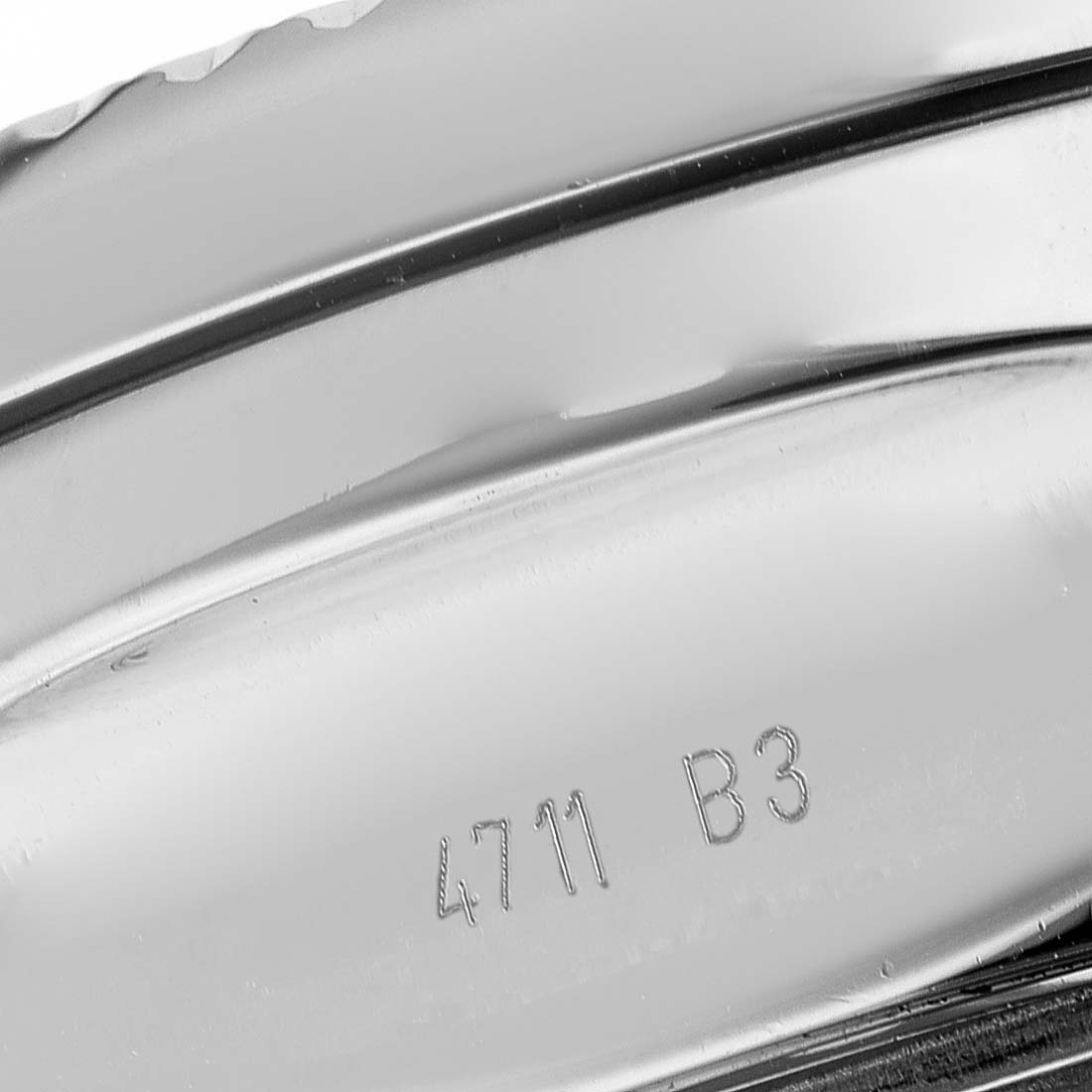 The image shows a close-up of the side and engraved details on the case of a Bentley model by Breitling.