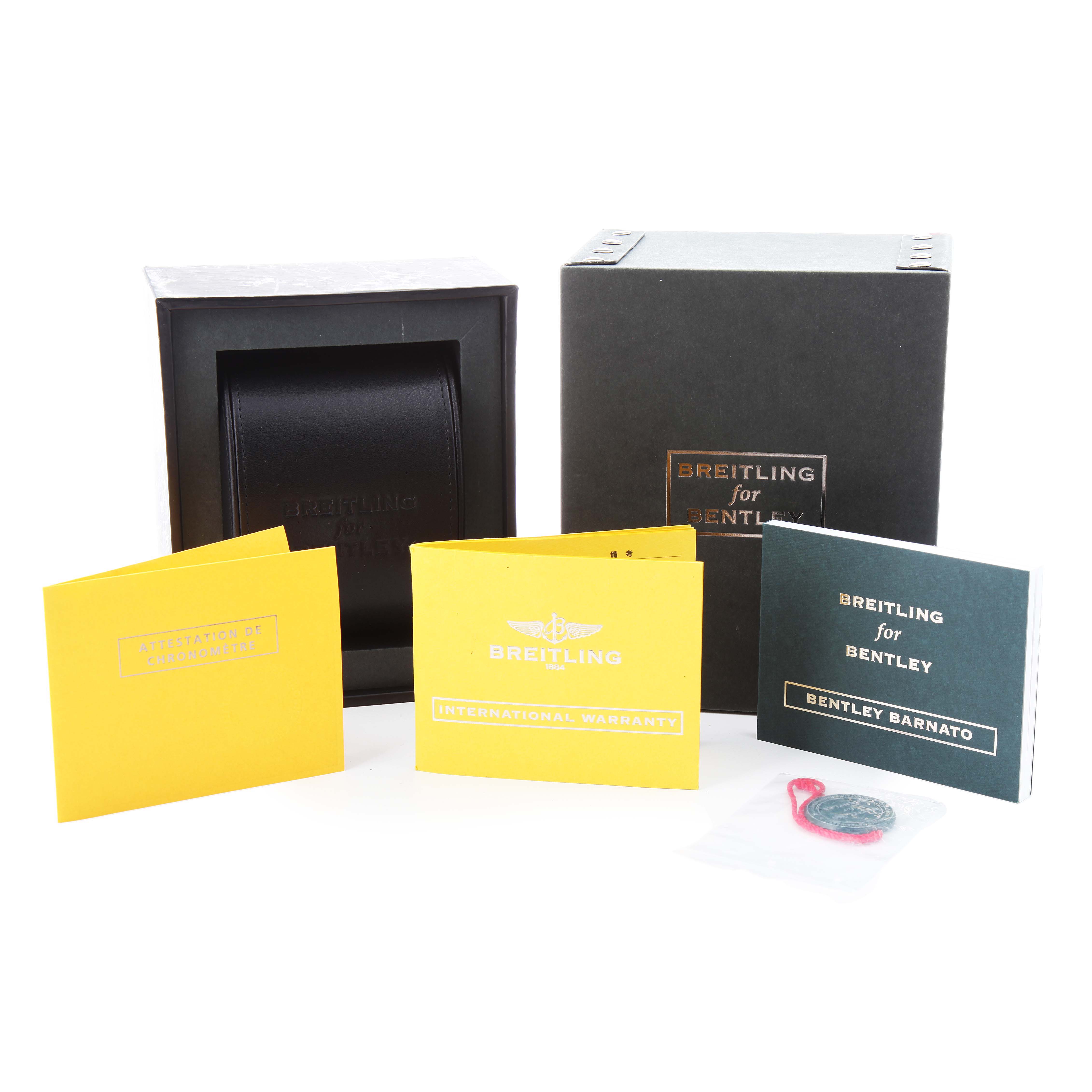 The Breitling for Bentley watch accessories include a box, manuals, and warranty cards displayed at a front angle.