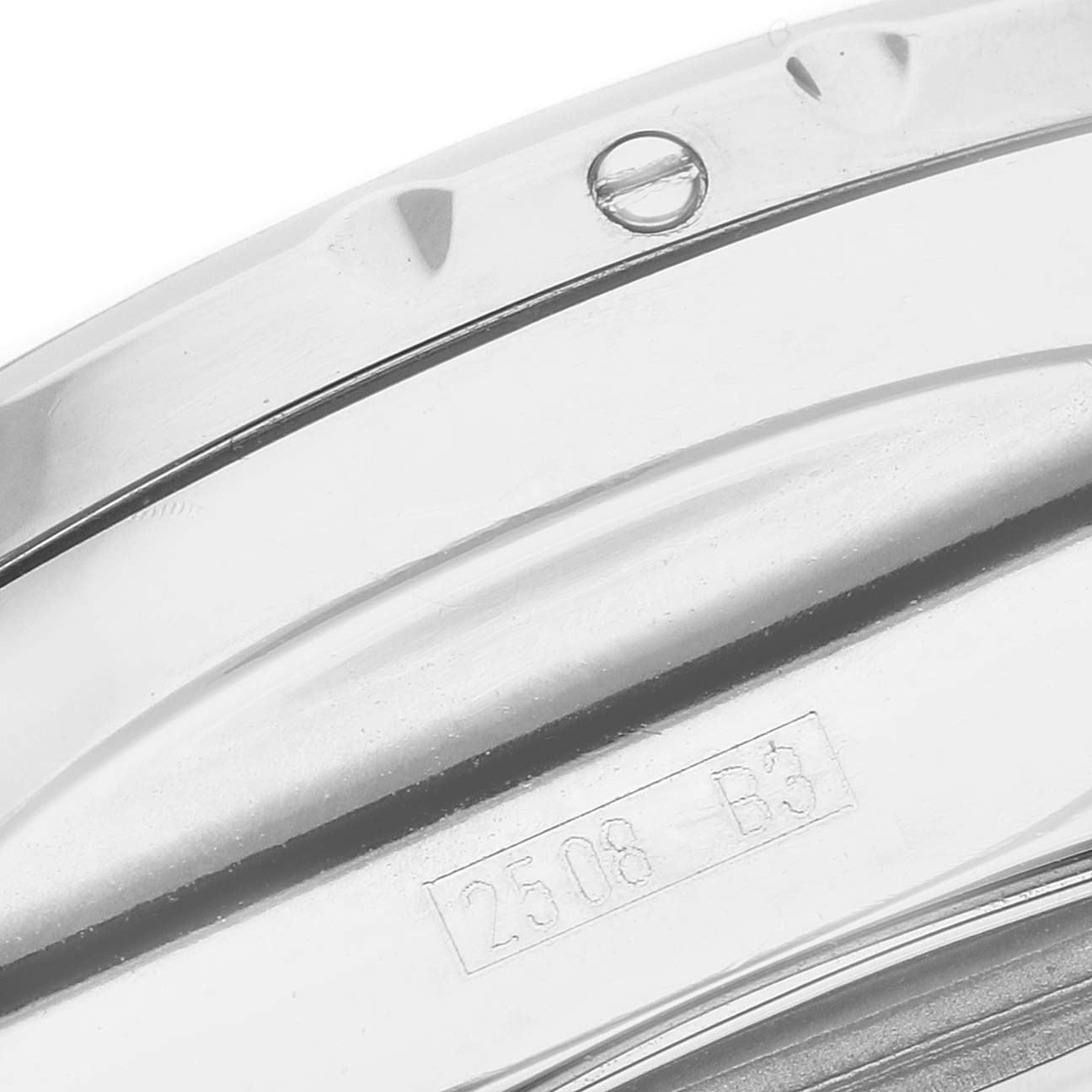 The image shows a close-up of the side of the bezel and part of the casing with engravings on the Bentley model by Breitling.