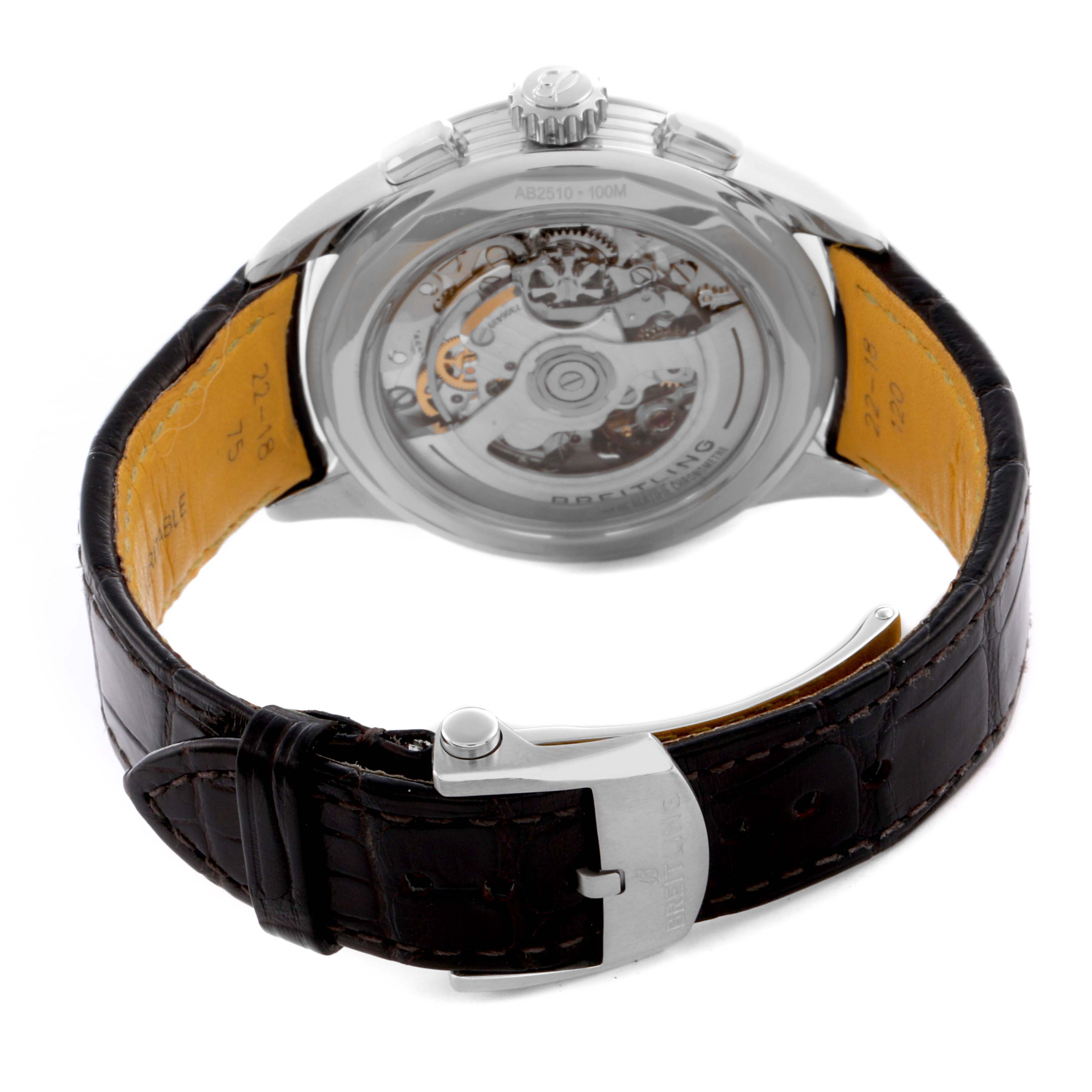 The Breitling Premier AB2510 Men's Stainless Steel Pink Dial AB2510 Men's Stainless Steel Pink Dial watch is shown from the back, highlighting its transparent case back and leather strap.