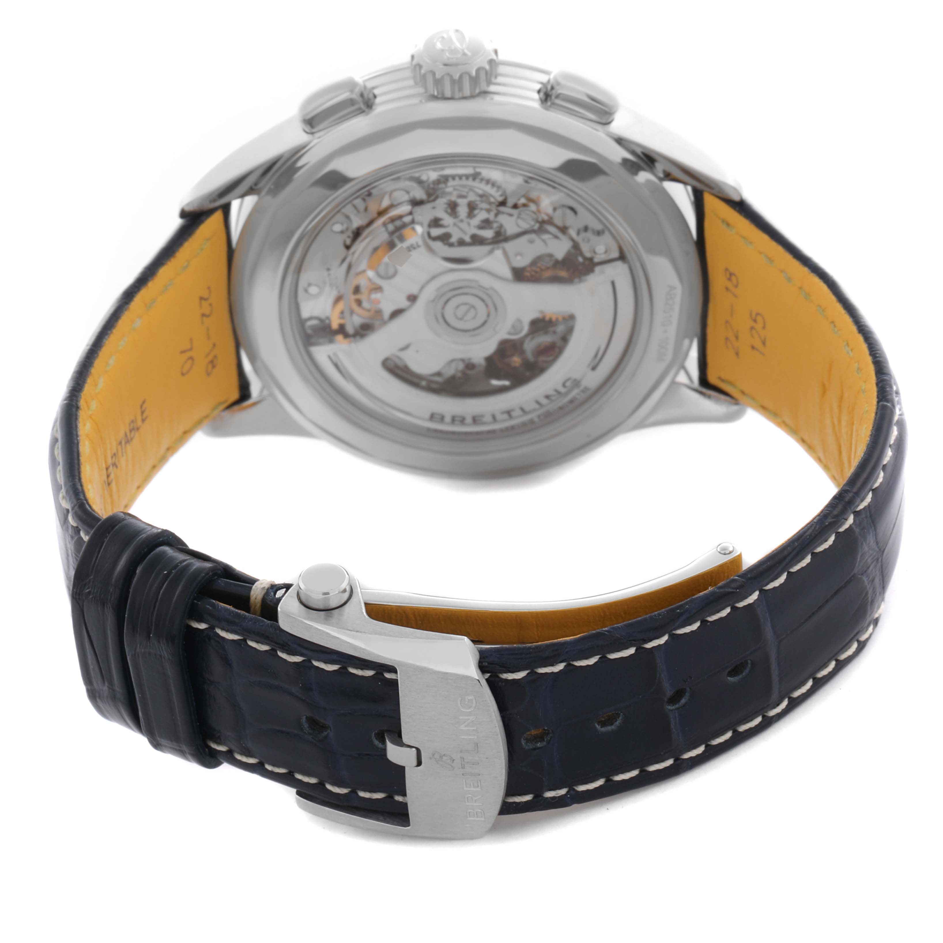 The Breitling Premier AB2510 Men's Stainless Steel Pink Dial AB2510 Men's Stainless Steel Pink Dial watch is shown from the back, highlighting the movement and leather strap with a buckle.