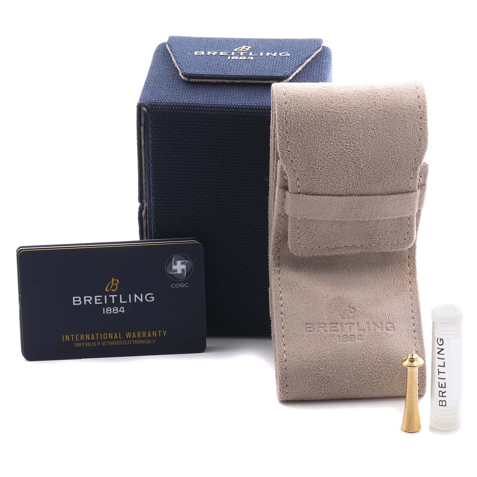 The image shows accessories for a Breitling Premier AB2510 Men's Stainless Steel Pink Dial AB2510 Men's Stainless Steel Pink Dial watch, including a box, pouch, warranty card, and tool.