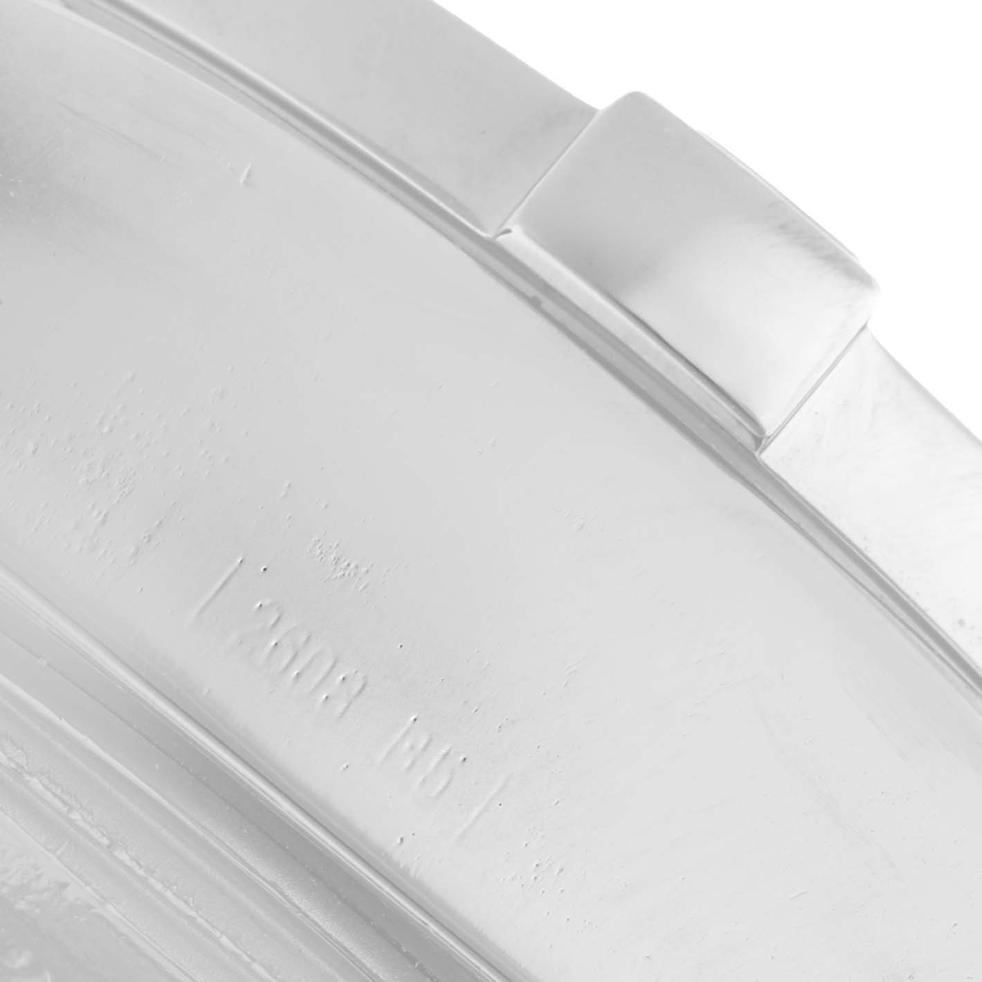 The image shows a close-up of the side of the Breitling Avenger A1337011 / B907 Men's Stainless Steel Black Dial bezel with part of the clasp visible.