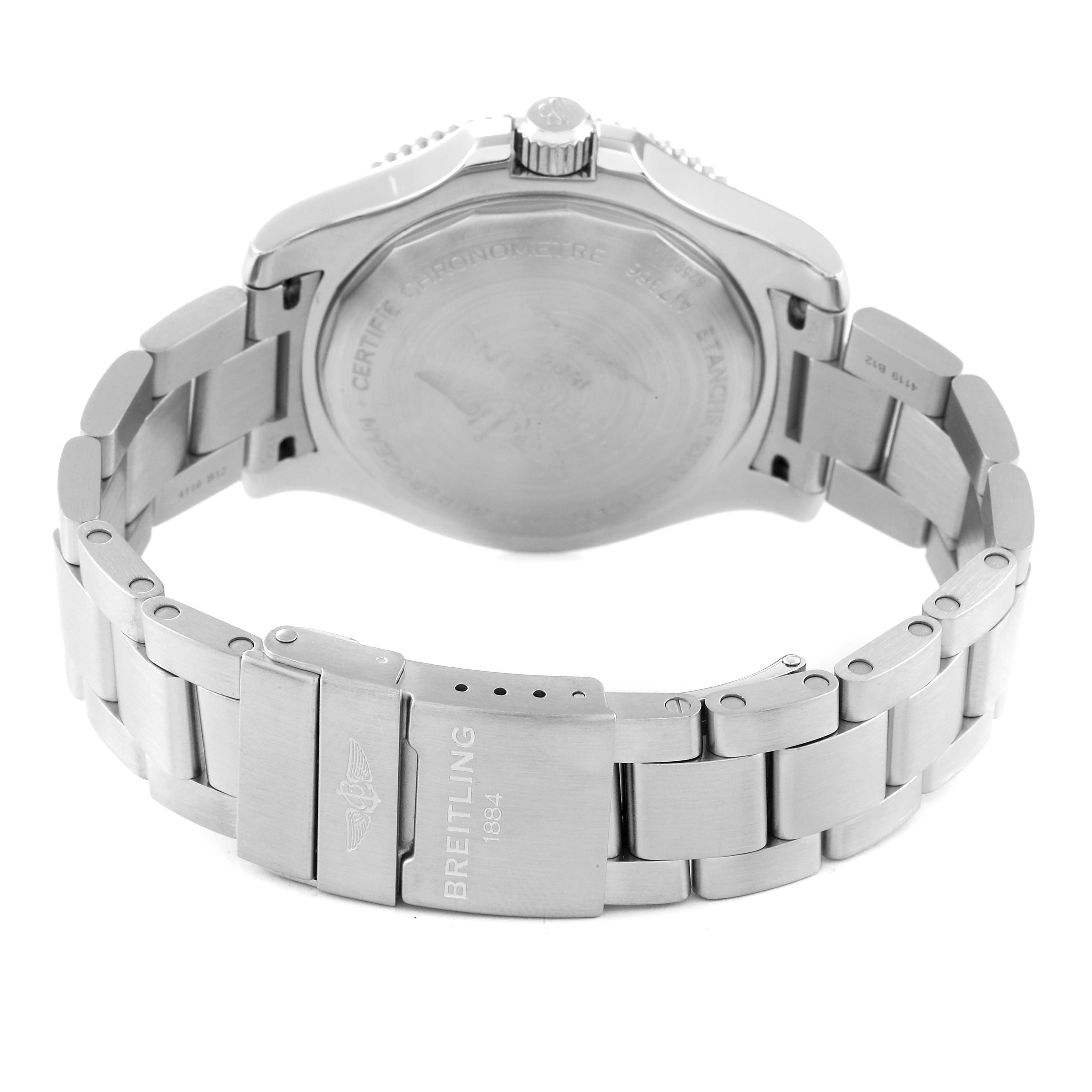 The image shows the back view of a Superocean model by Breitling and its stainless steel bracelet.