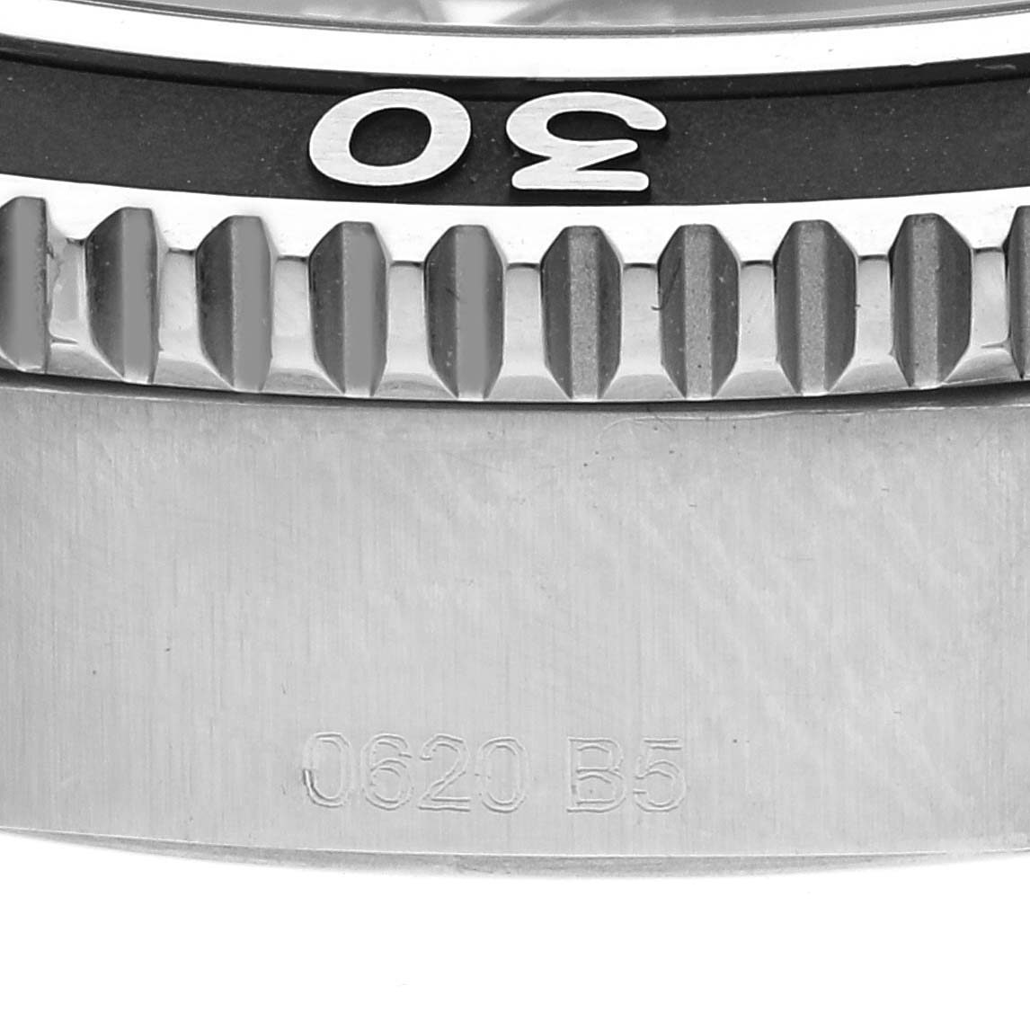 Close-up of the bezel and case of a Breitling Superocean A17366 Men's Stainless Steel Black Dial A17366 Men's Stainless Steel Black Dial watch, displaying the number "30" and serial number "0620 B5."