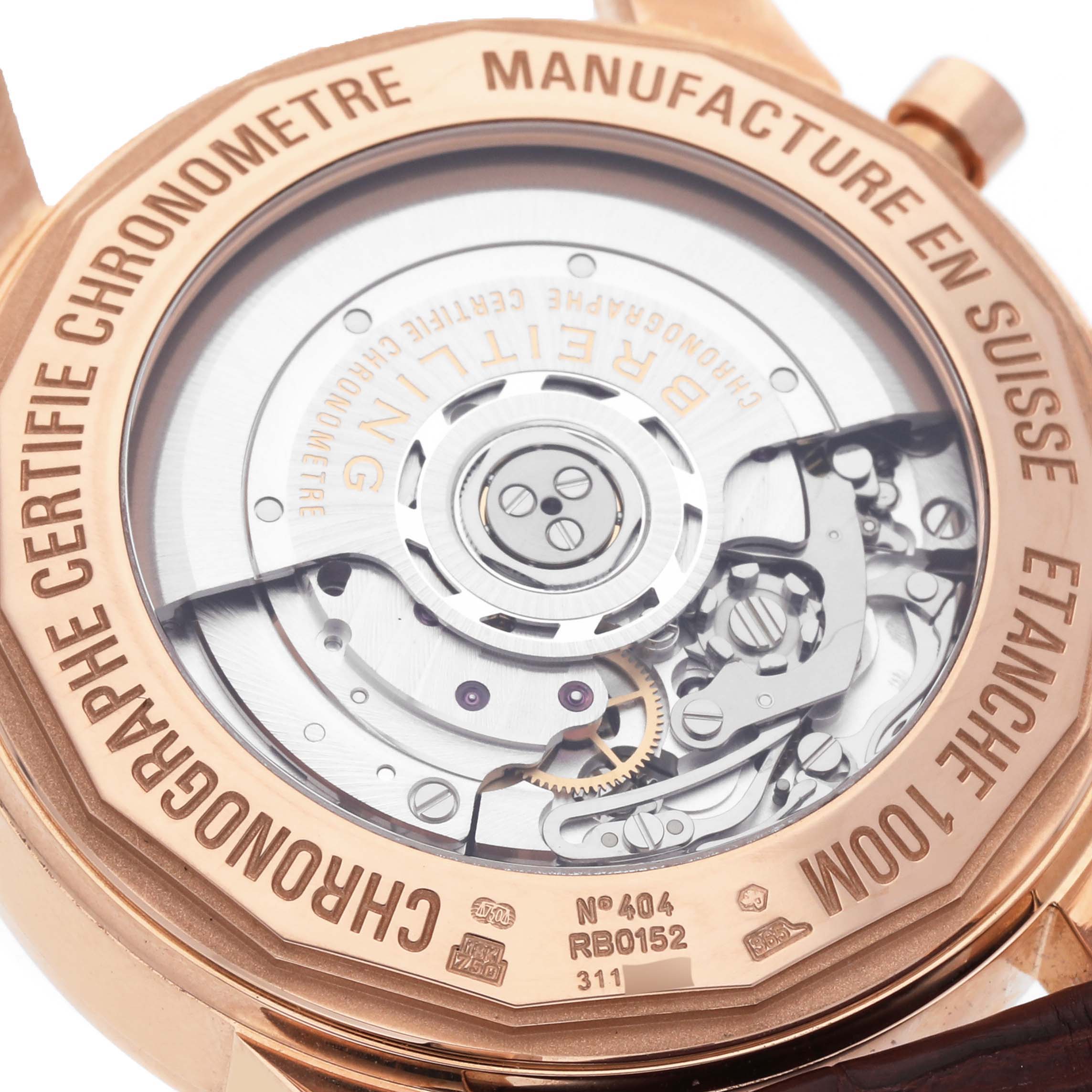 The image shows the back of a Breitling Transocean RB0152 Men's Rose Gold Silver Dial RB0152 Men's Rose Gold Silver Dial watch, highlighting its internal mechanics and engraved details.