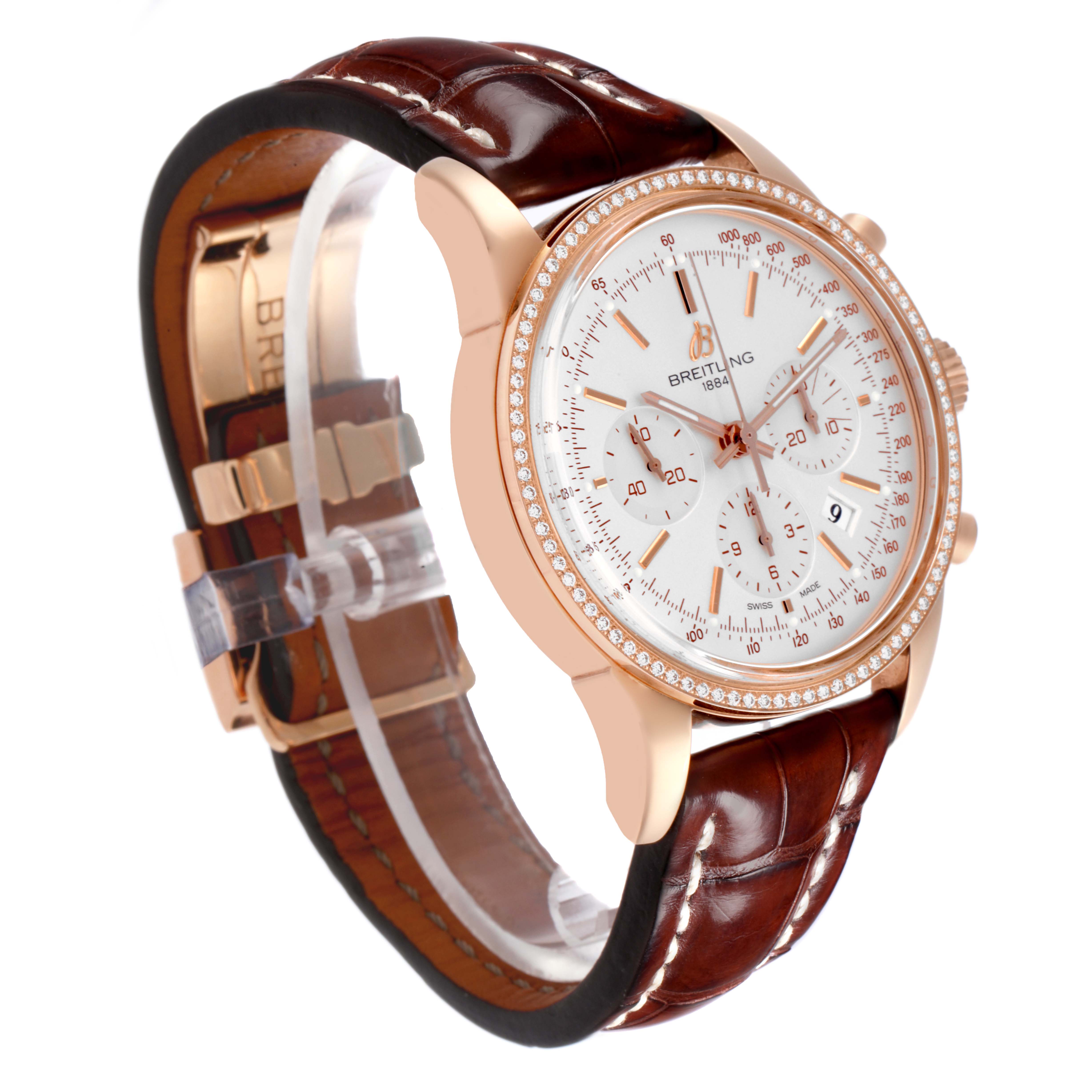 The Breitling Transocean RB0152 Men's Rose Gold Silver Dial RB0152 Men's Rose Gold Silver Dial watch is shown from a side angle, displaying the case, dial, bezel, and leather strap.