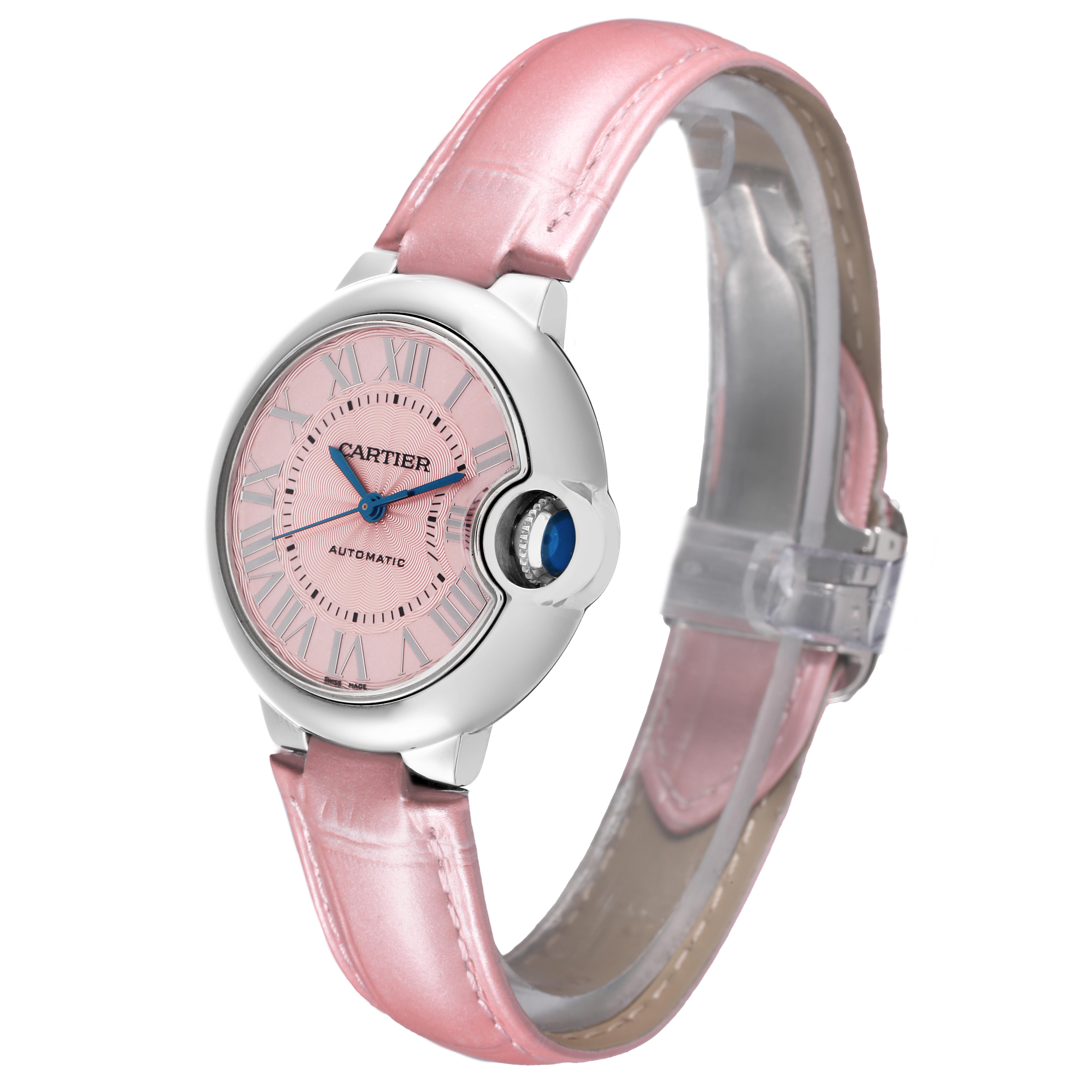The Cartier Ballon Bleu WSBB0002 Women's Stainless Steel Pink Dial WSBB0002 Women's Stainless Steel Pink Dial watch is shown at an angle displaying the face, crown, and pink leather strap.