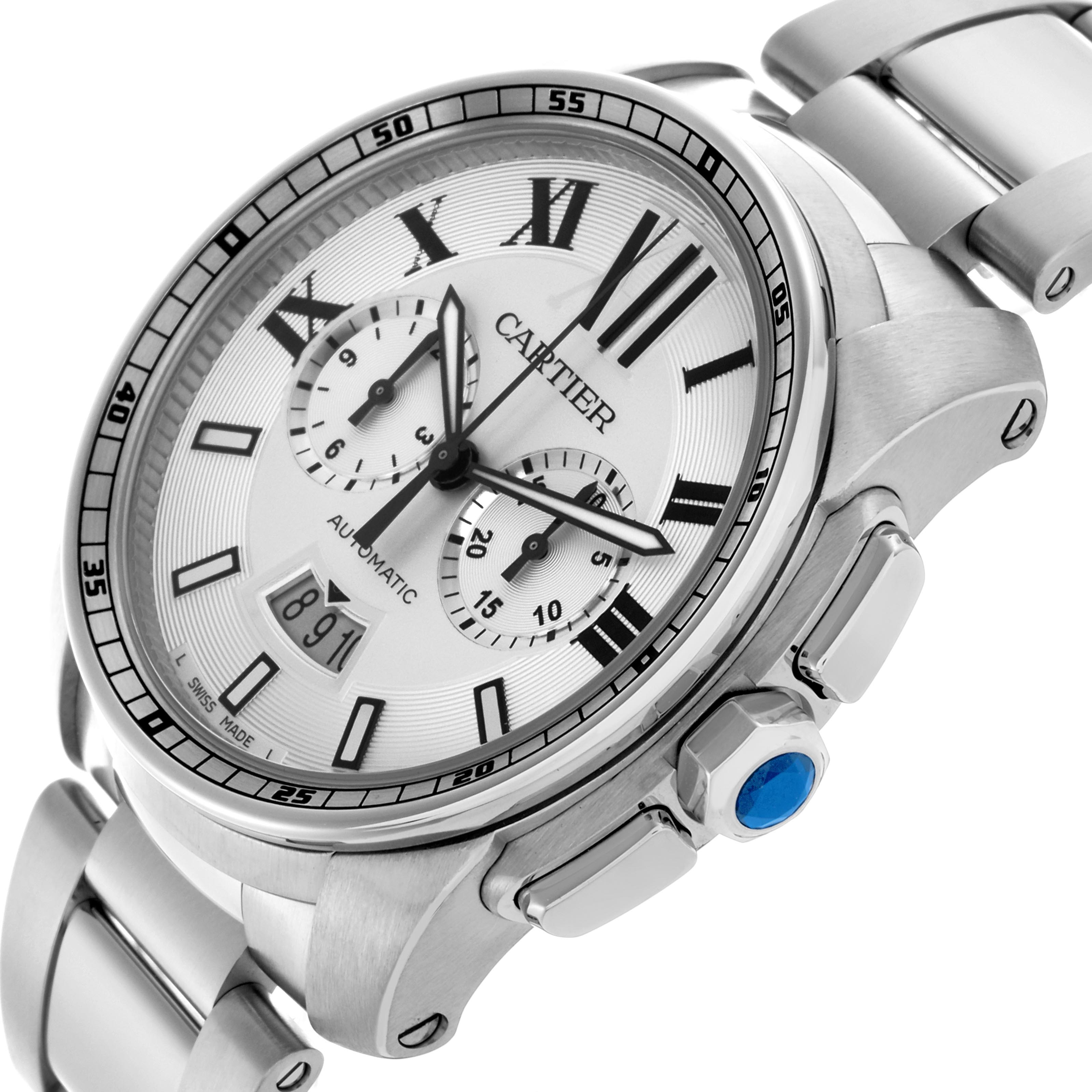 The Calibre de Cartier watch is shown at a tilted angle highlighting the face, bezel, and part of the bracelet.