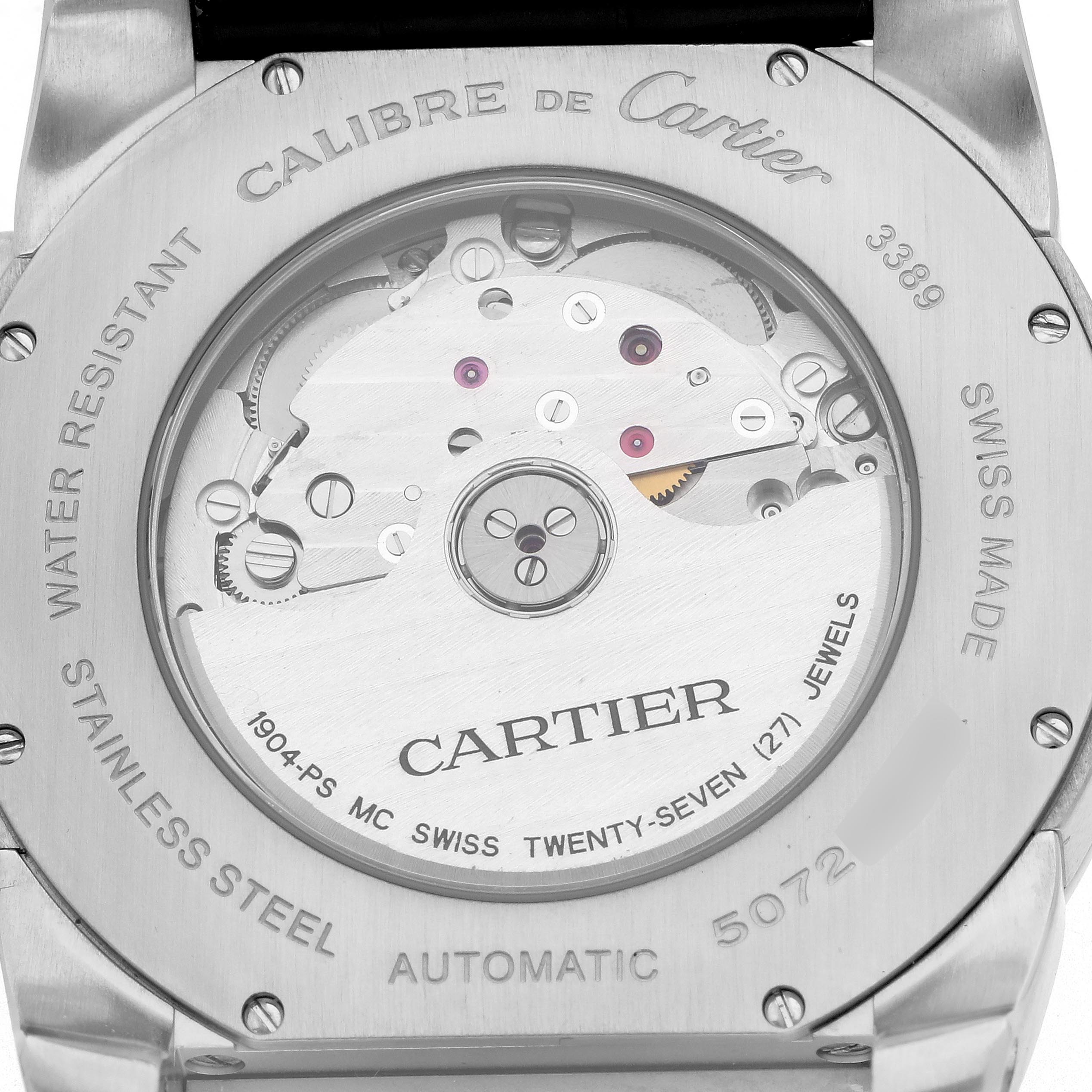 The image shows the back of a Calibre de Cartier watch, highlighting the automatic movement and internal mechanics.