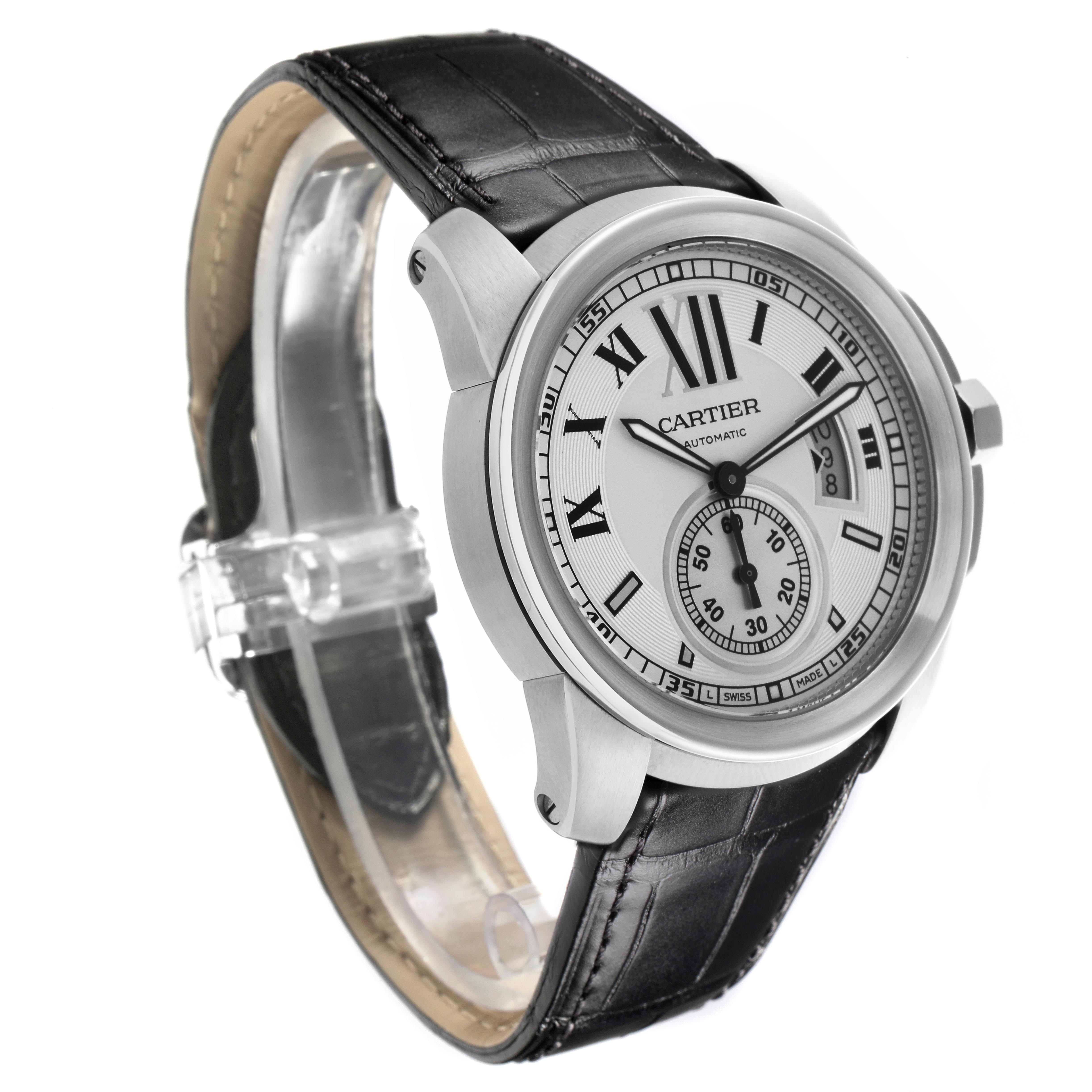 The Calibre de Cartier watch by Cartier is shown at a three-quarter angle, highlighting the face, bezel, and leather strap.