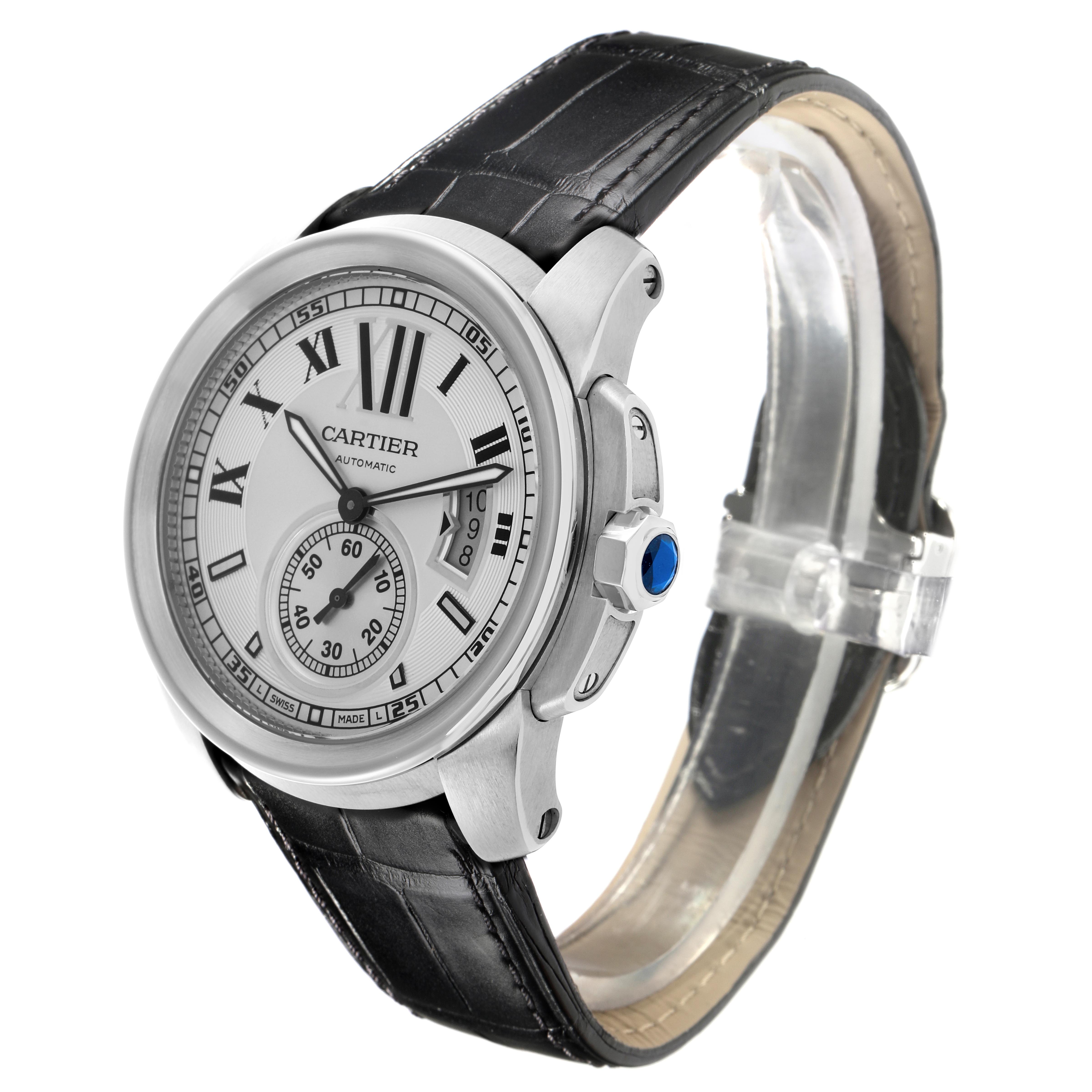 The Calibre de Cartier watch is shown at a three-quarter angle, featuring its face, bezel, crown, and leather strap.