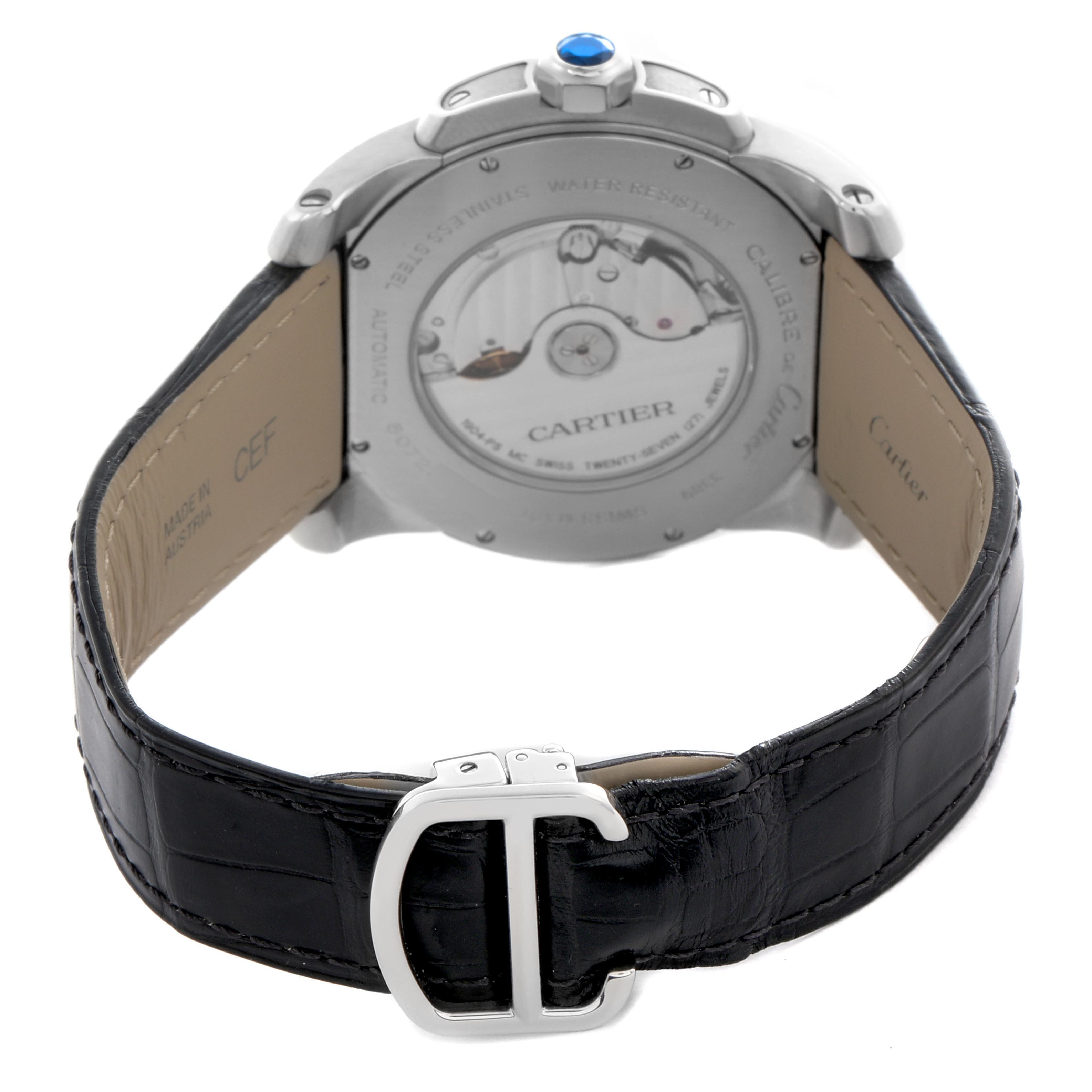 The image shows the back of the Calibre de Cartier watch, highlighting the automatic movement and leather strap with buckle.