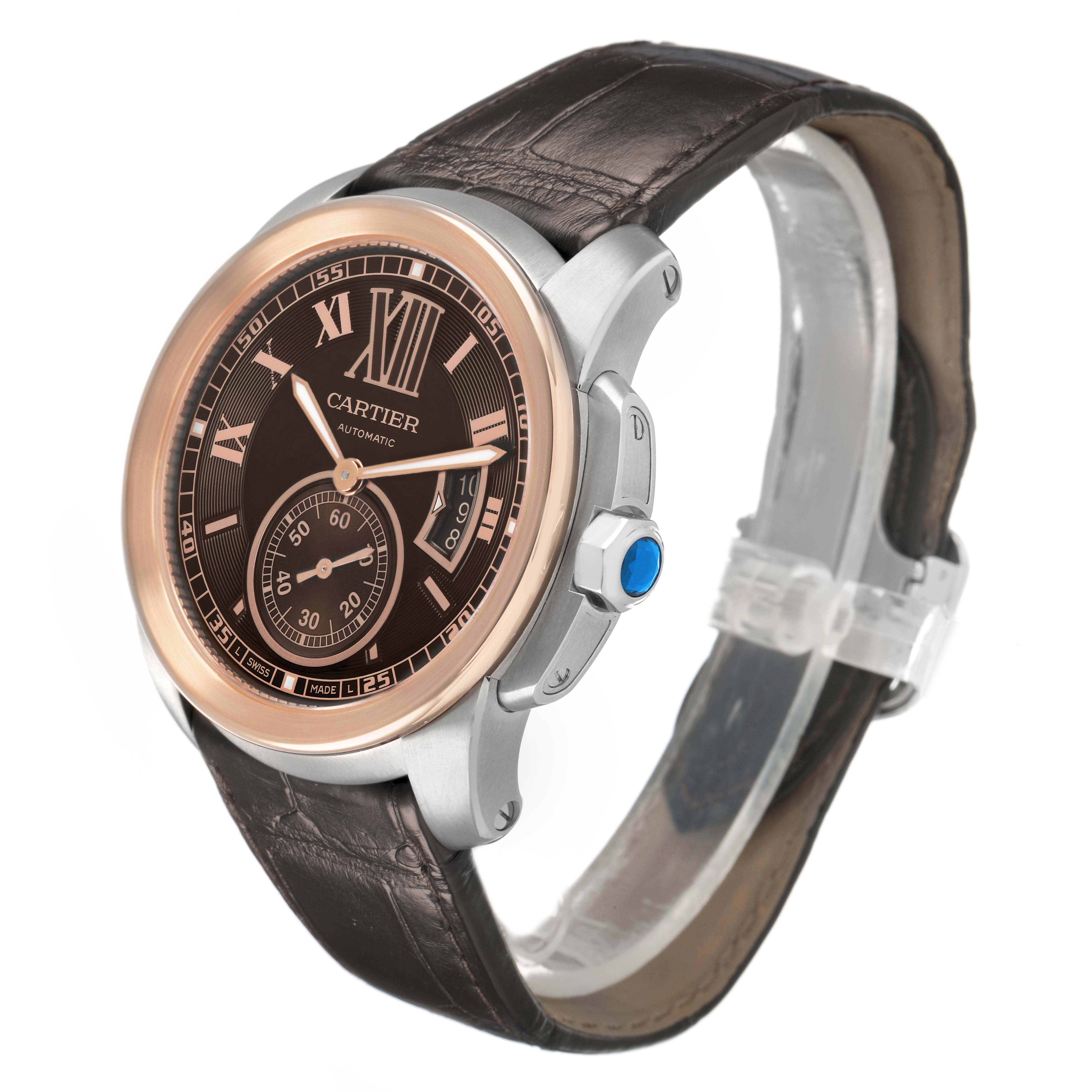 The watch is a Calibre de Cartier model by Cartier, shown at a three-quarter angle, highlighting the dial, bezel, strap, and crown.