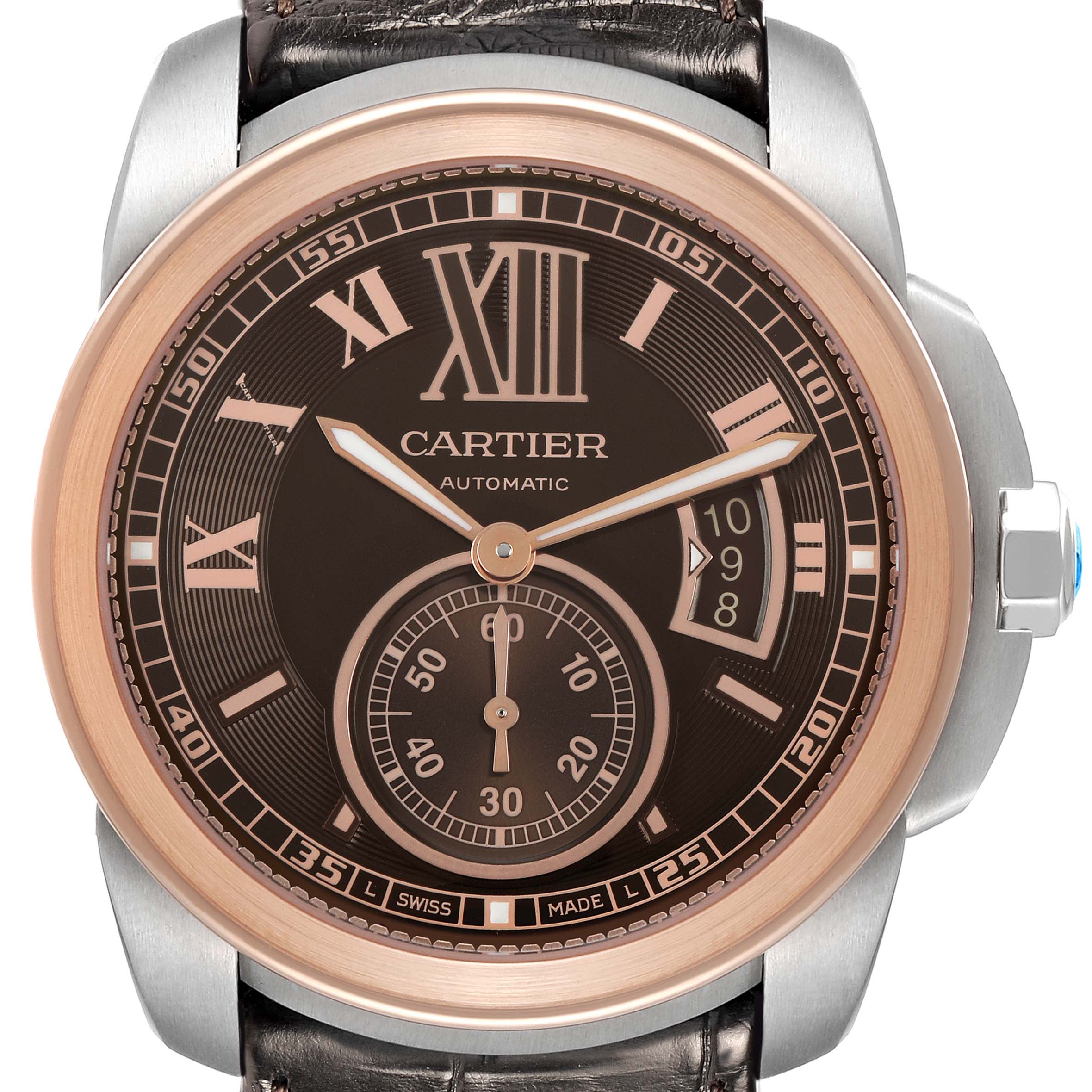 The Cartier Calibre de Cartier W7100051 Men's Steel and Gold (two tone) Brown Dial watch is shown from a frontal angle, displaying the dial, hands, crown, and a portion of the strap.