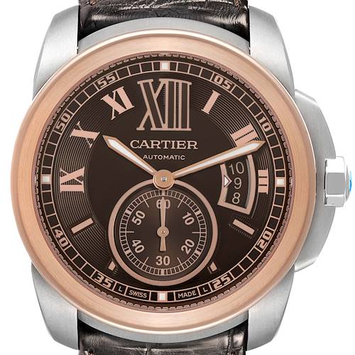 The image shows a front view of the Calibre de Cartier watch, highlighting its face, bezel, and crown.