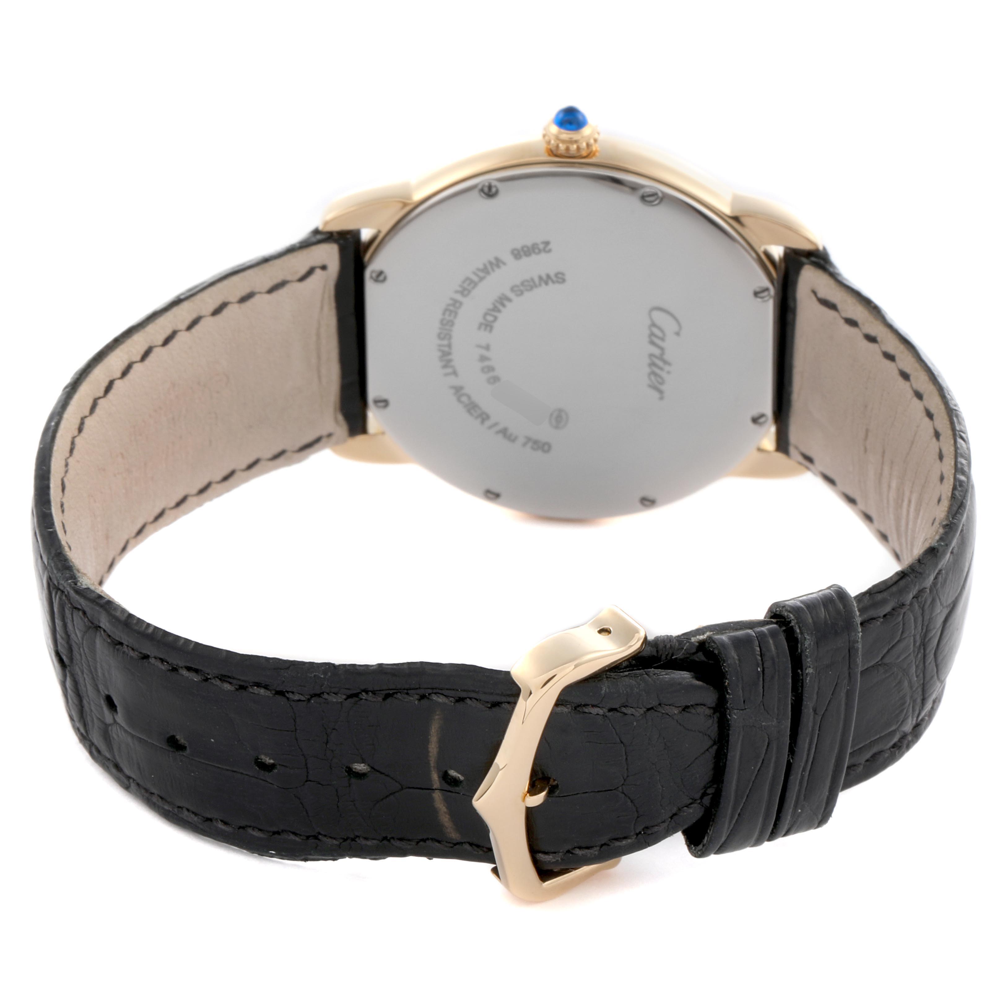 The image shows the back of a Cartier Ronde W6700455 Men
s Yellow Gold Silver Dial W6700455 Men
s Yellow Gold Silver Dial watch, featuring its case, crown, and black leather strap with a buckle.