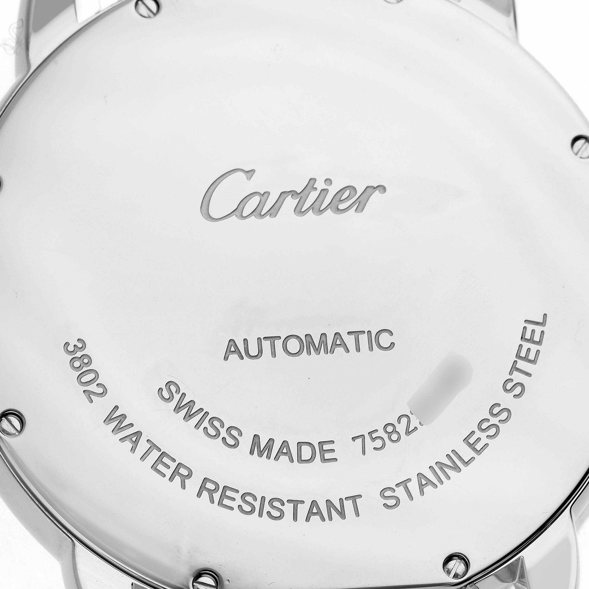 This image shows the back case of a Ronde model watch by Cartier, displaying information about its automatic movement and water resistance.