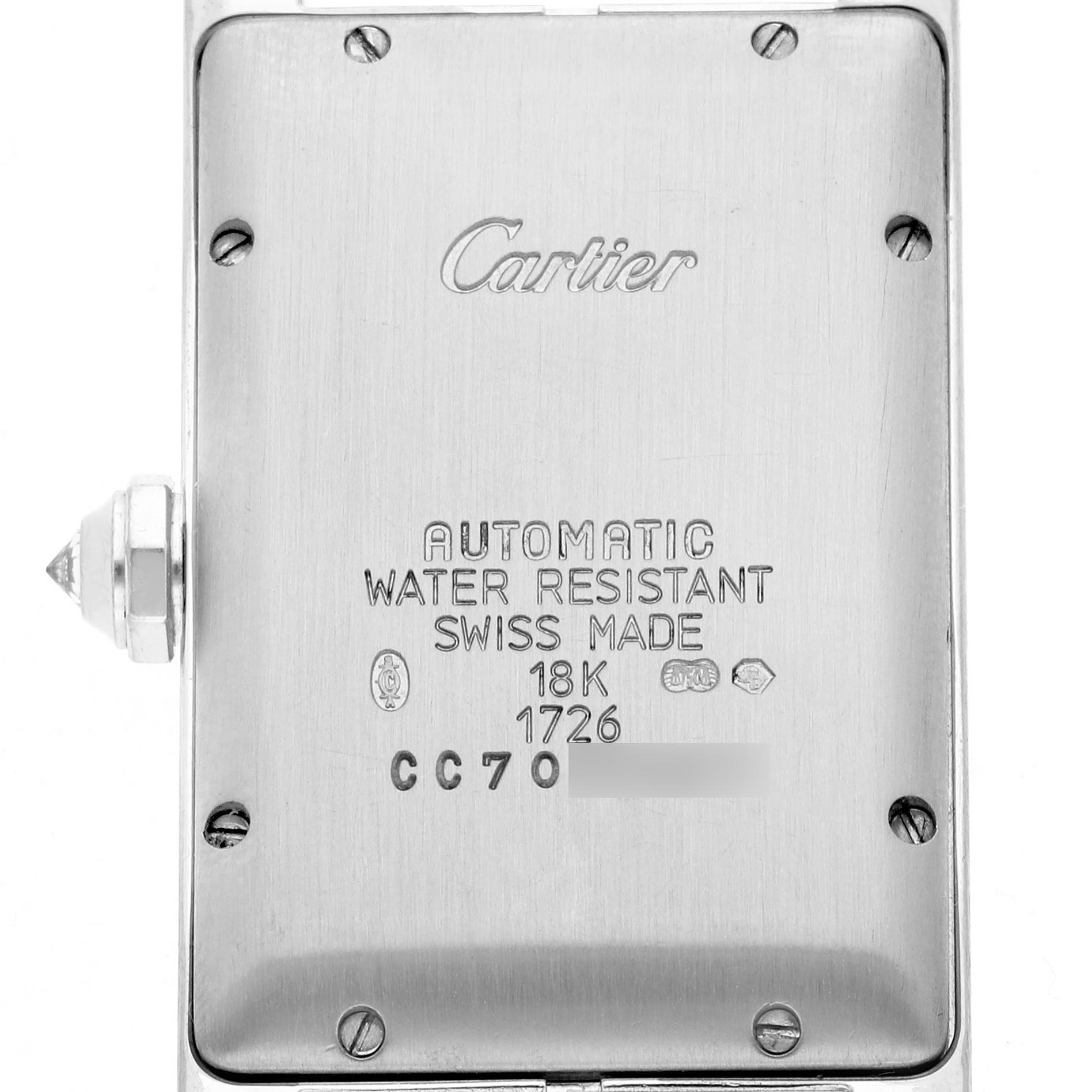 The image shows the back of a Cartier Tank Americaine WB702651 Women's White Gold Silver Dial WB702651 Women's White Gold Silver Dial watch, displaying the case back engravings and the crown side view.