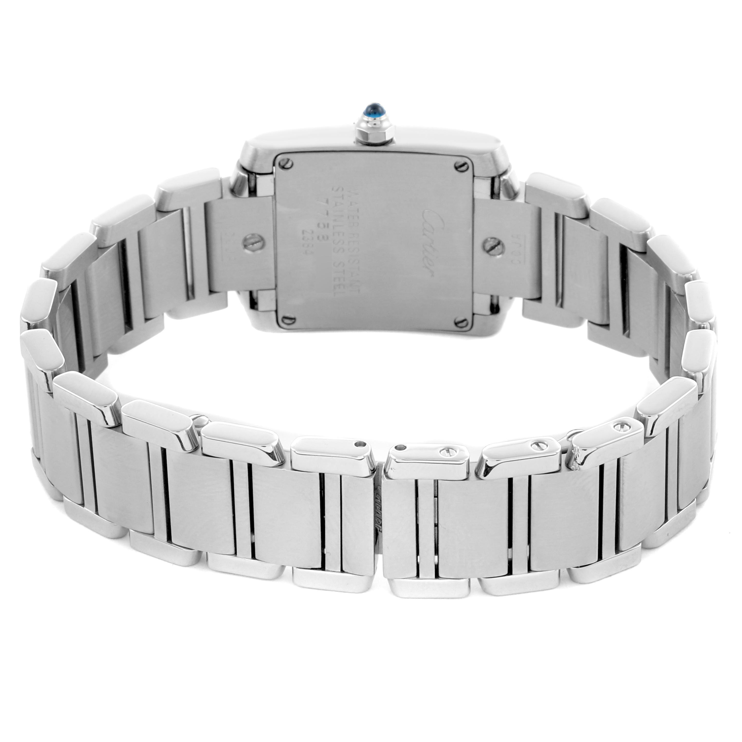 The Cartier Tank Française watch is shown from the back, highlighting the case back and metal bracelet links.