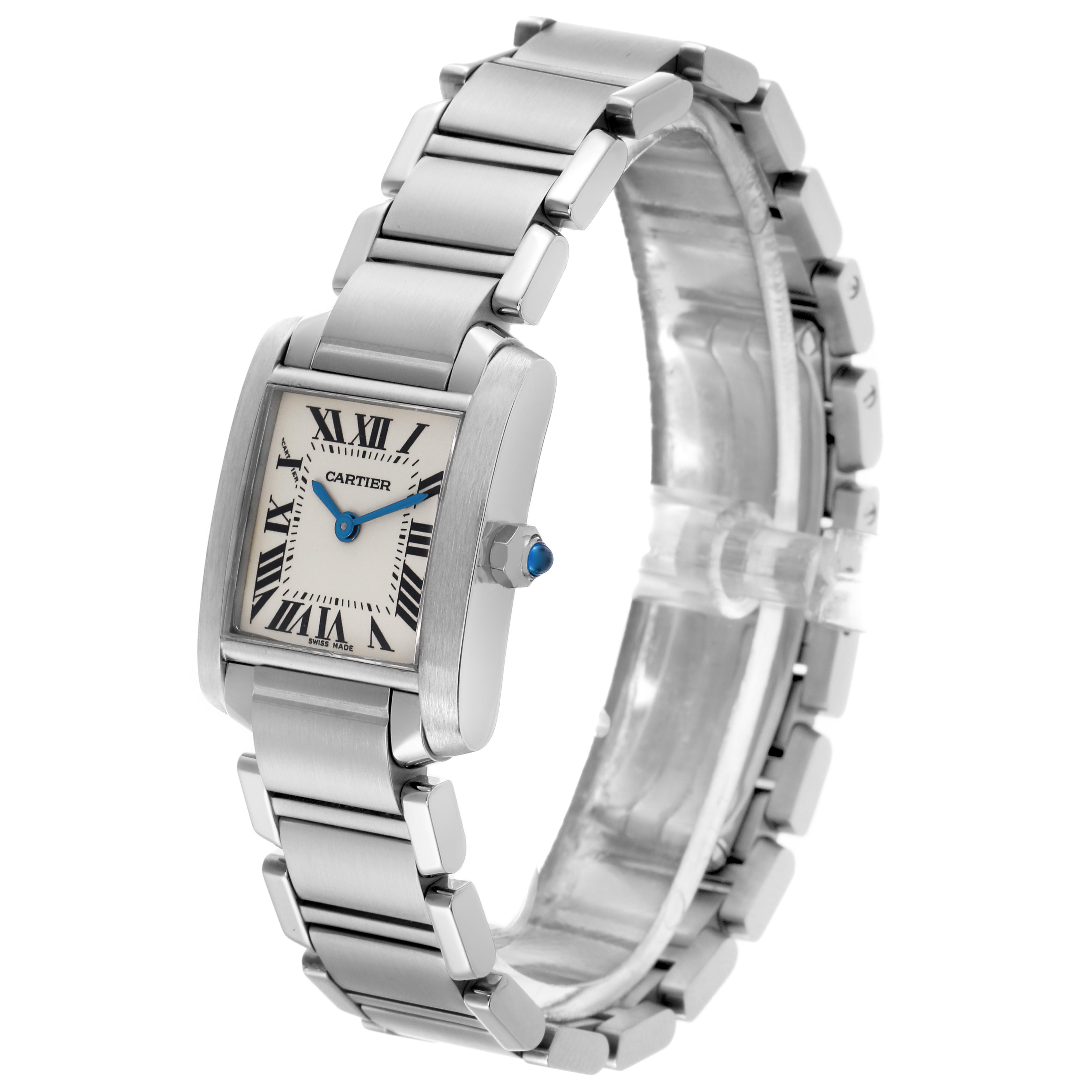 The Cartier Tank Française watch is shown at an angle highlighting the face, bezel, crown, and bracelet.